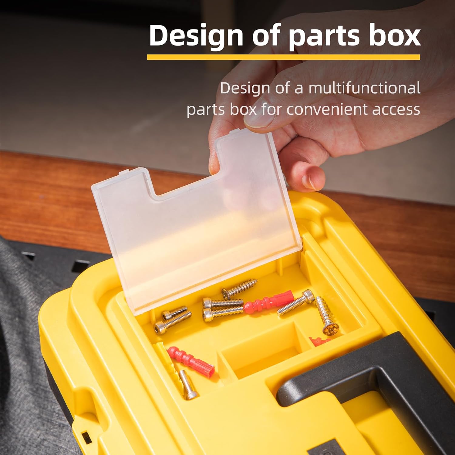 Close-up of the deli tool box lid, showing the transparent cover of the small parts compartment with screws and anchors inside.