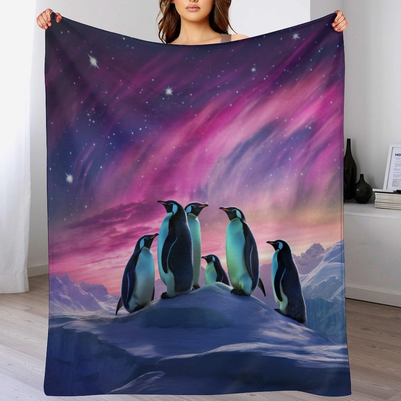 Couverture pingouin douce contre le froid sur le lit