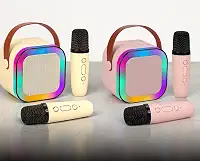 Karaokê Rosa com 2 Microfones Sem Fio e Som Bluetooth: Portátil, recarregável e com modos de voz divertidos. Luzes LED para transformar sua casa em um palco de verdade. Cores Rosa e Bege.