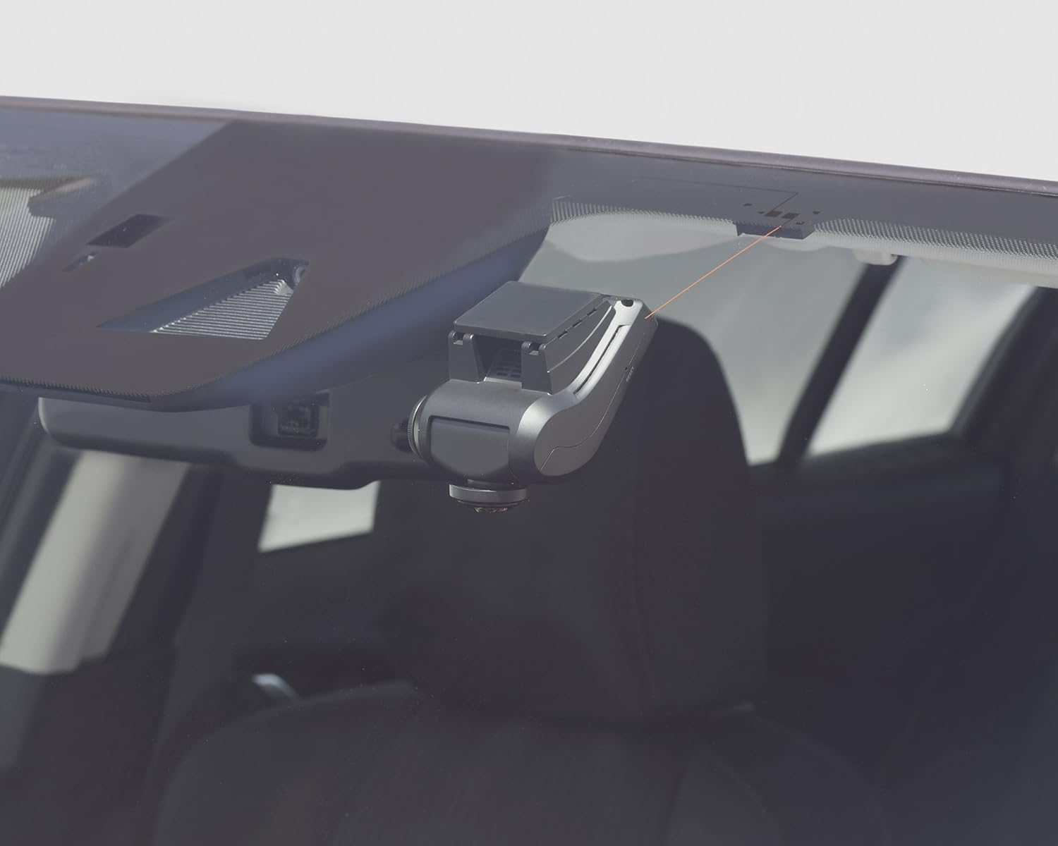 Dashcam installed discreetly on a car windshield