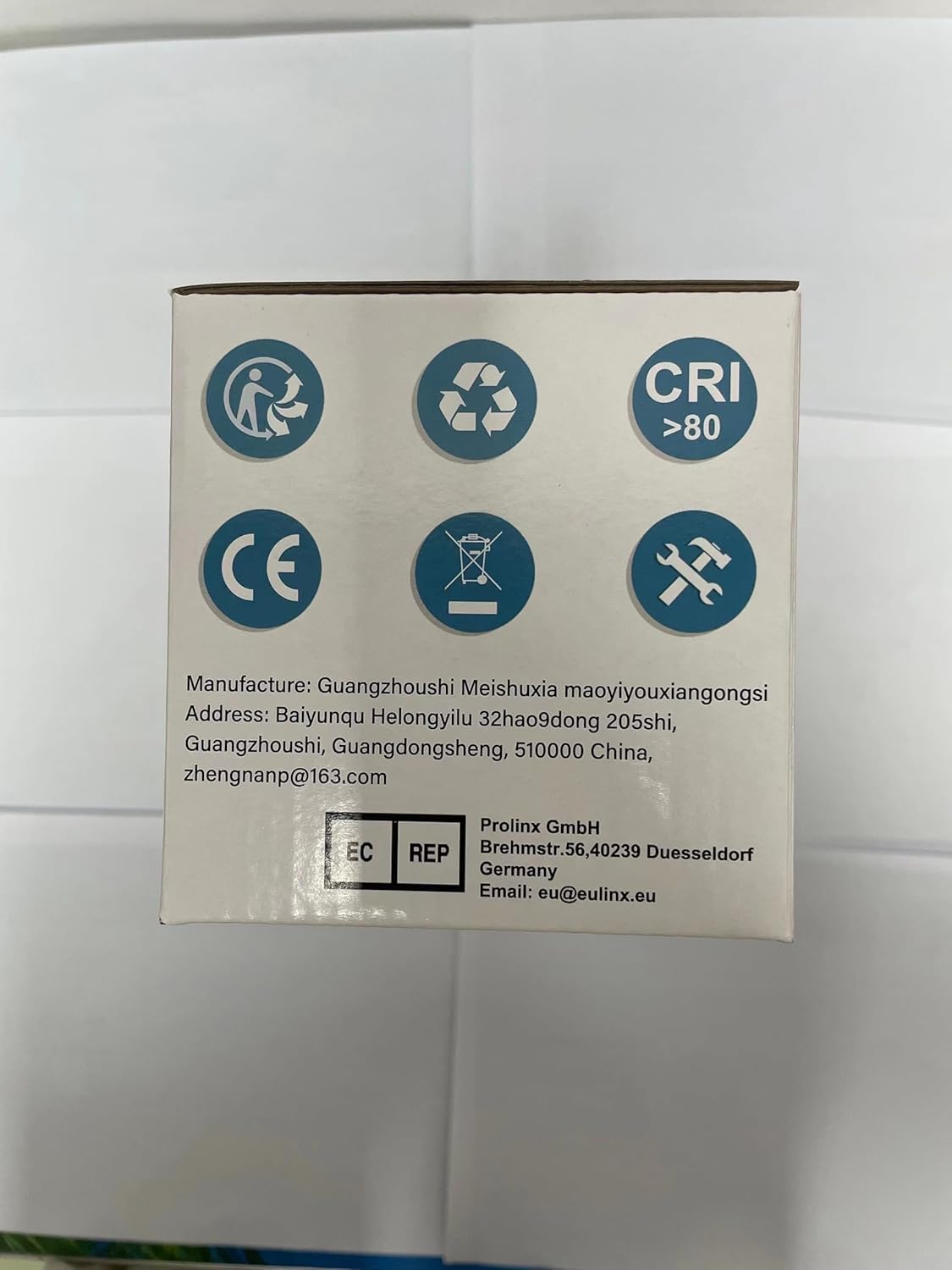 Side of the product box showing manufacturer and EU representative contact details.