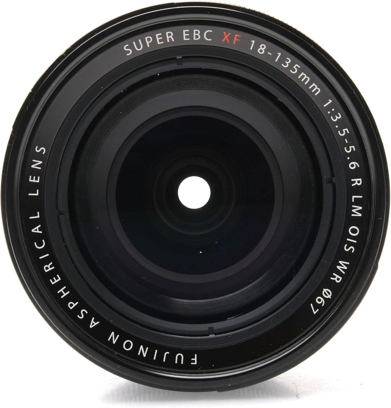 Blaen view of Fujifilm XF 18-135mm lens showing the front element and lens information.
