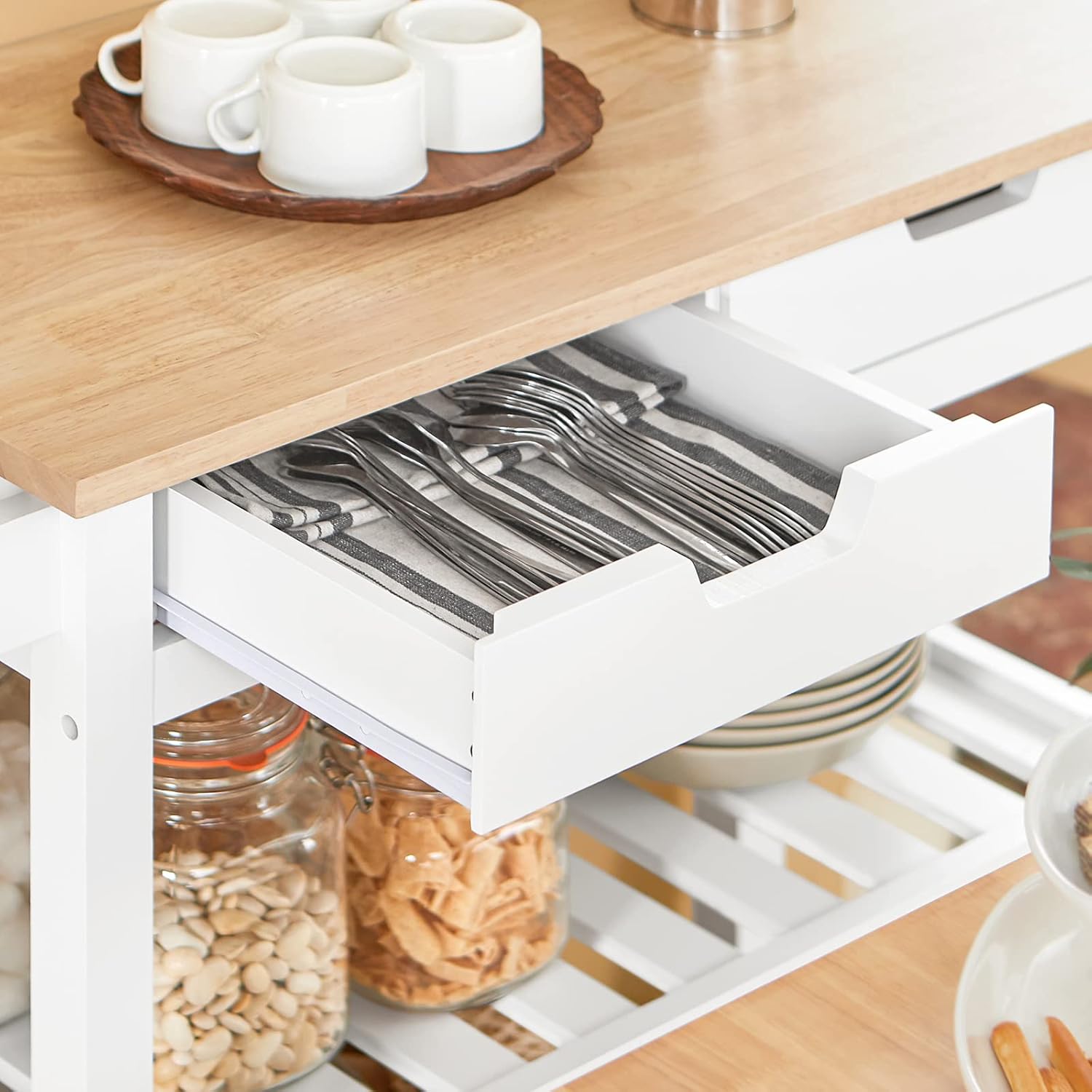 Close-up of an open drawer on the SoBuy FKW68-WN Kitchen Cart, showing stored cutlery