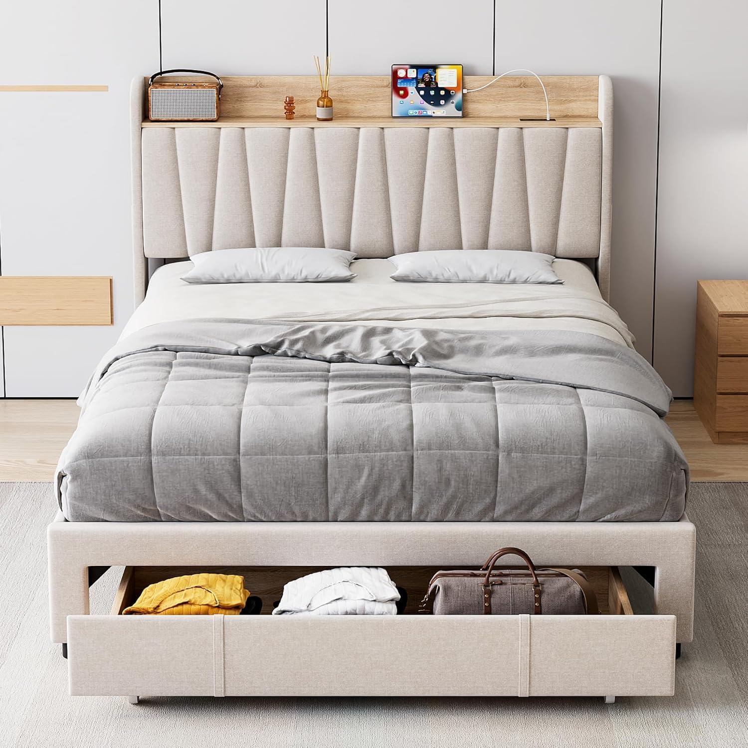 Bed frame with a storage drawer pulled out, showing items stored inside