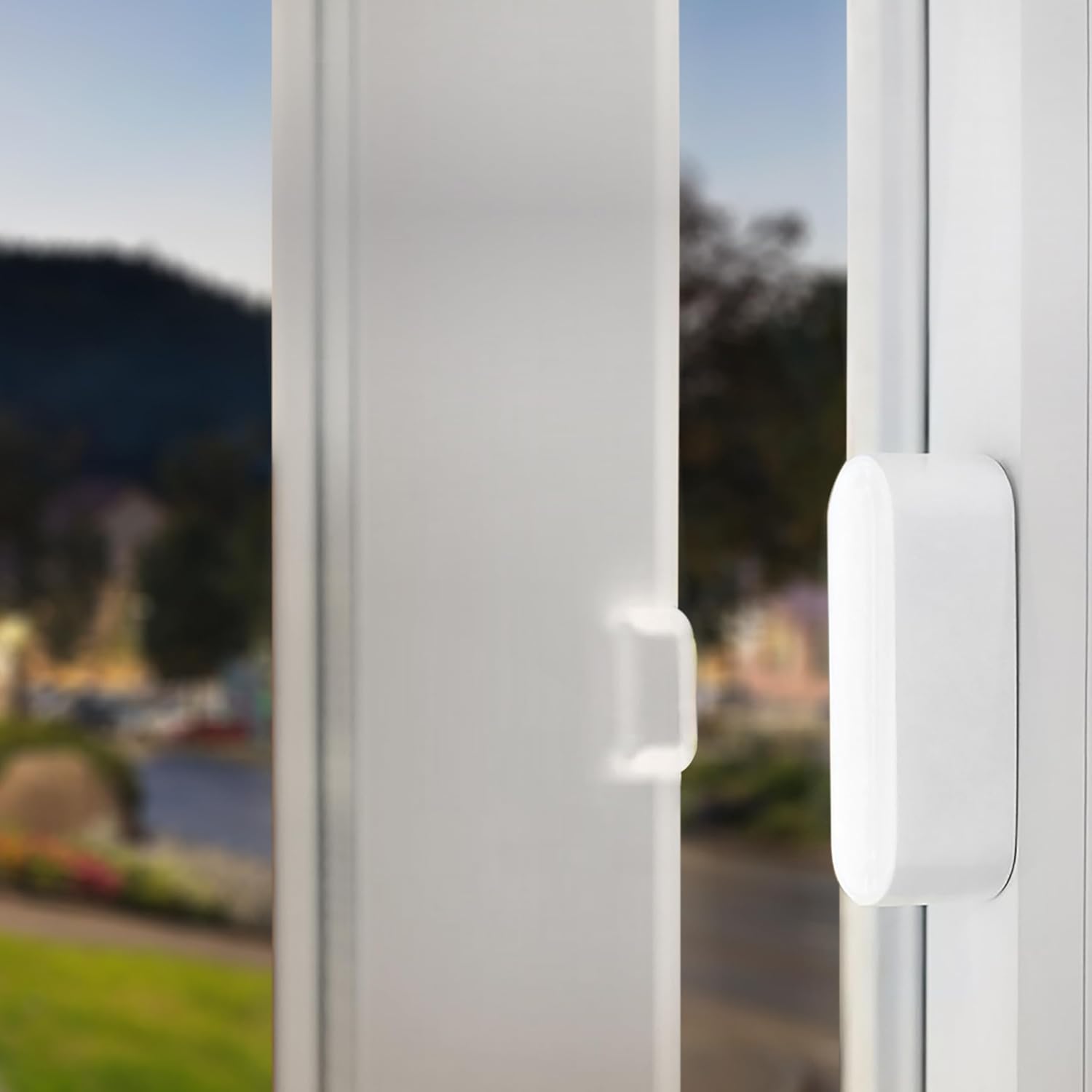A person installing the Nivian NV-D3D-U1 door and window sensor on a window frame, demonstrating easy installation.