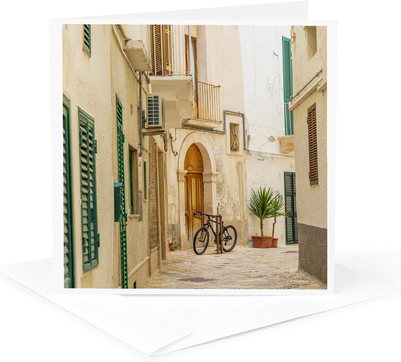 Italy, Apulia, Bari, Monopoli. Narrow street with a bicycle. 1 Greeting Card with envelope