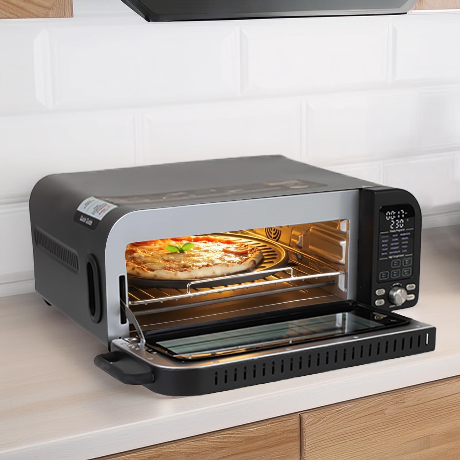 Berlinger Haus Electric Pizza Oven on a kitchen counter with a pizza inside