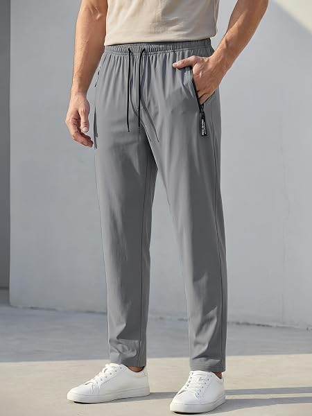 Pantalones deportivos para hombre, pantalones deportivos ligeros de secado rápido con cintura elástica y bolsillos con cremallera - 1