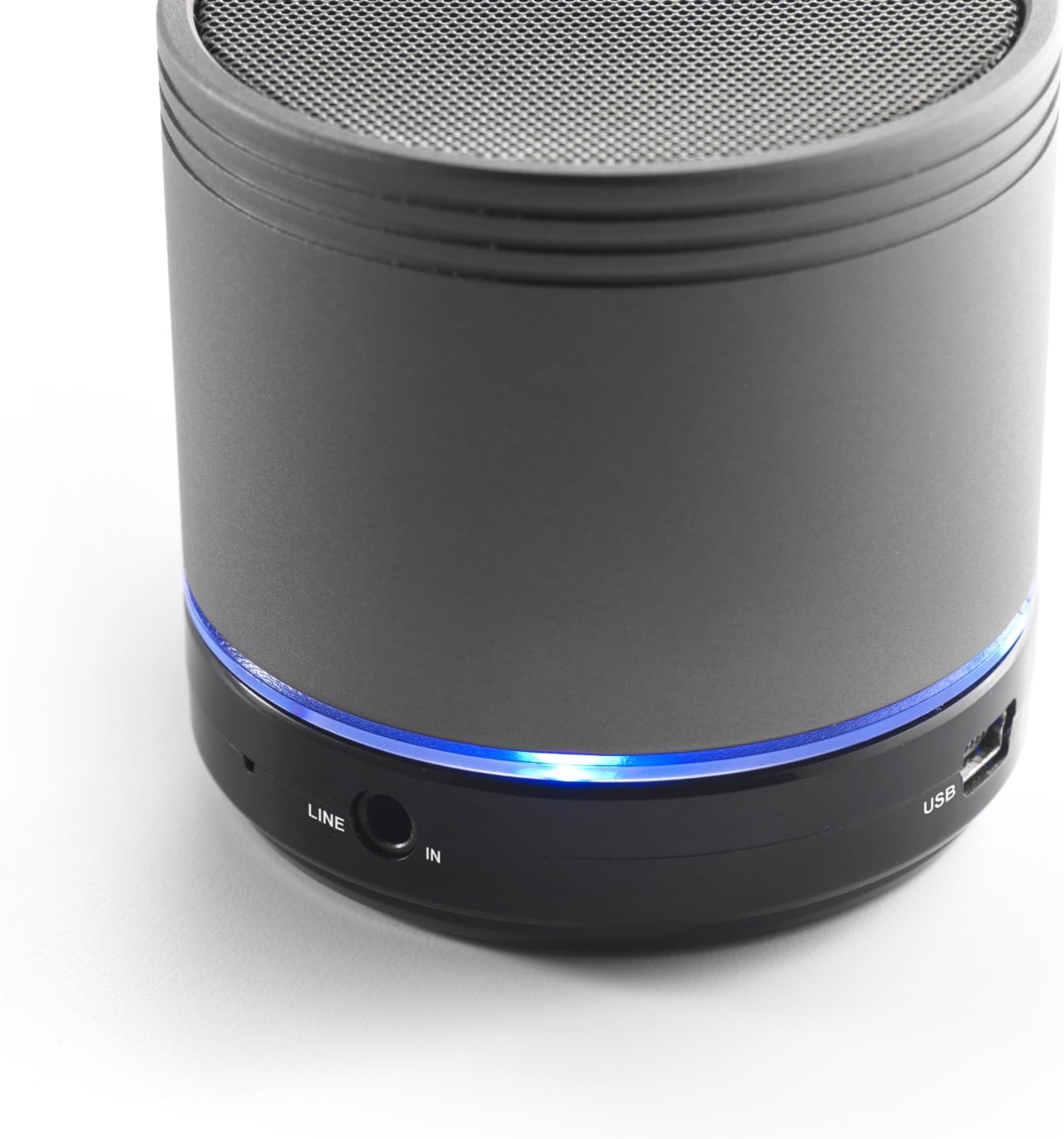 Close-up of the iCES IBT-1 speaker's base, showing the 'LINE IN' port and 'USB' charging port, with a blue LED light.