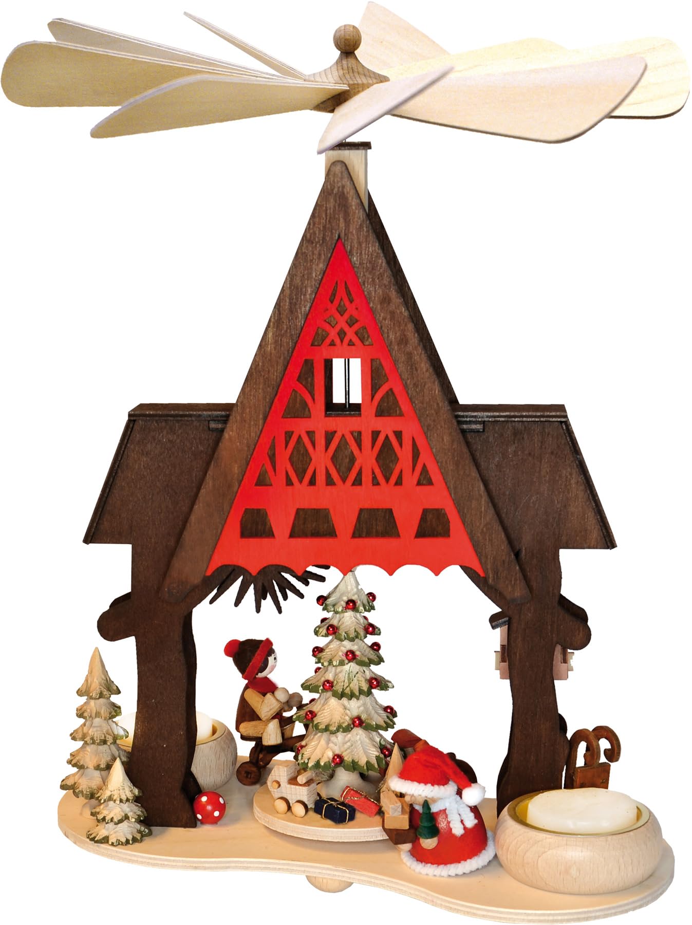 Père Noël et enfant avec tricycle sur pyramide en bois traditionnelle