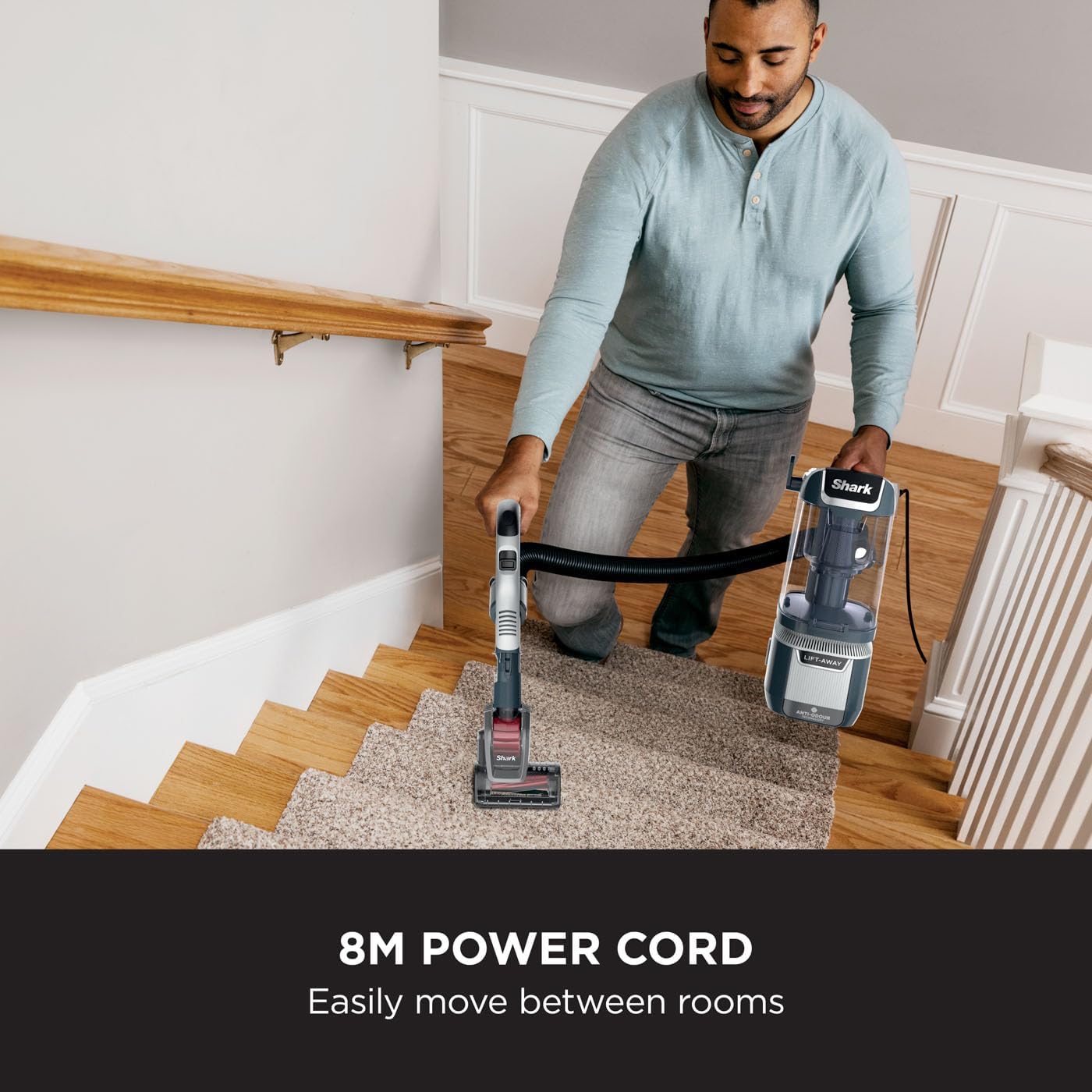 Man using Shark NZ780UKT with 8m power cord