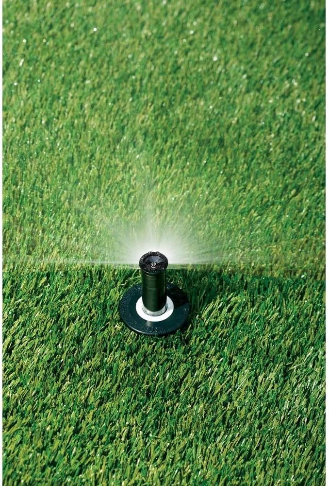 Spese generali view of a sprinkler spraying water onto grass.