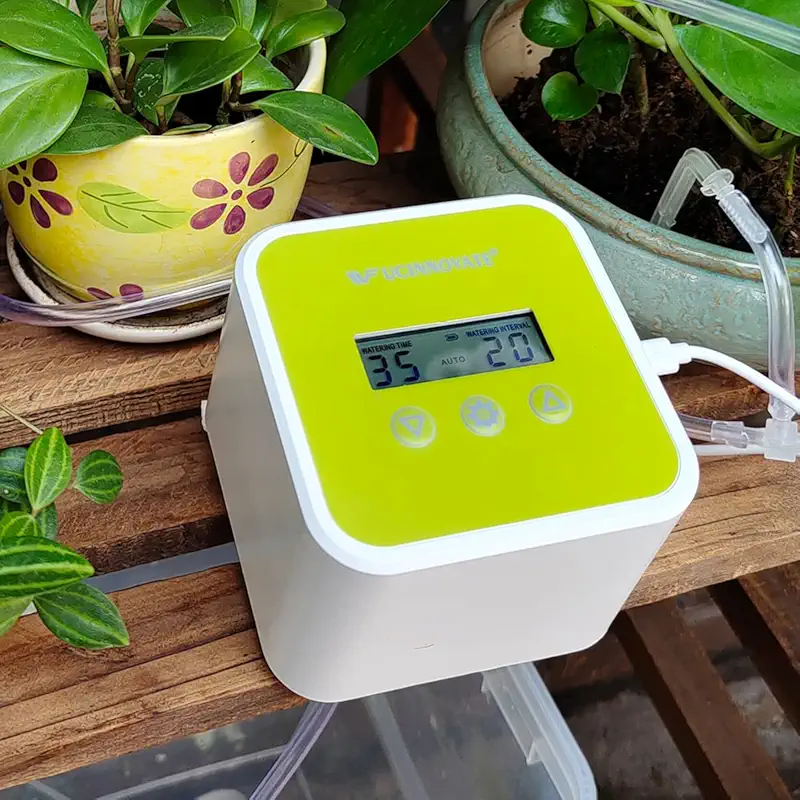 green digital watering system connected with tubes to keep plants moist.