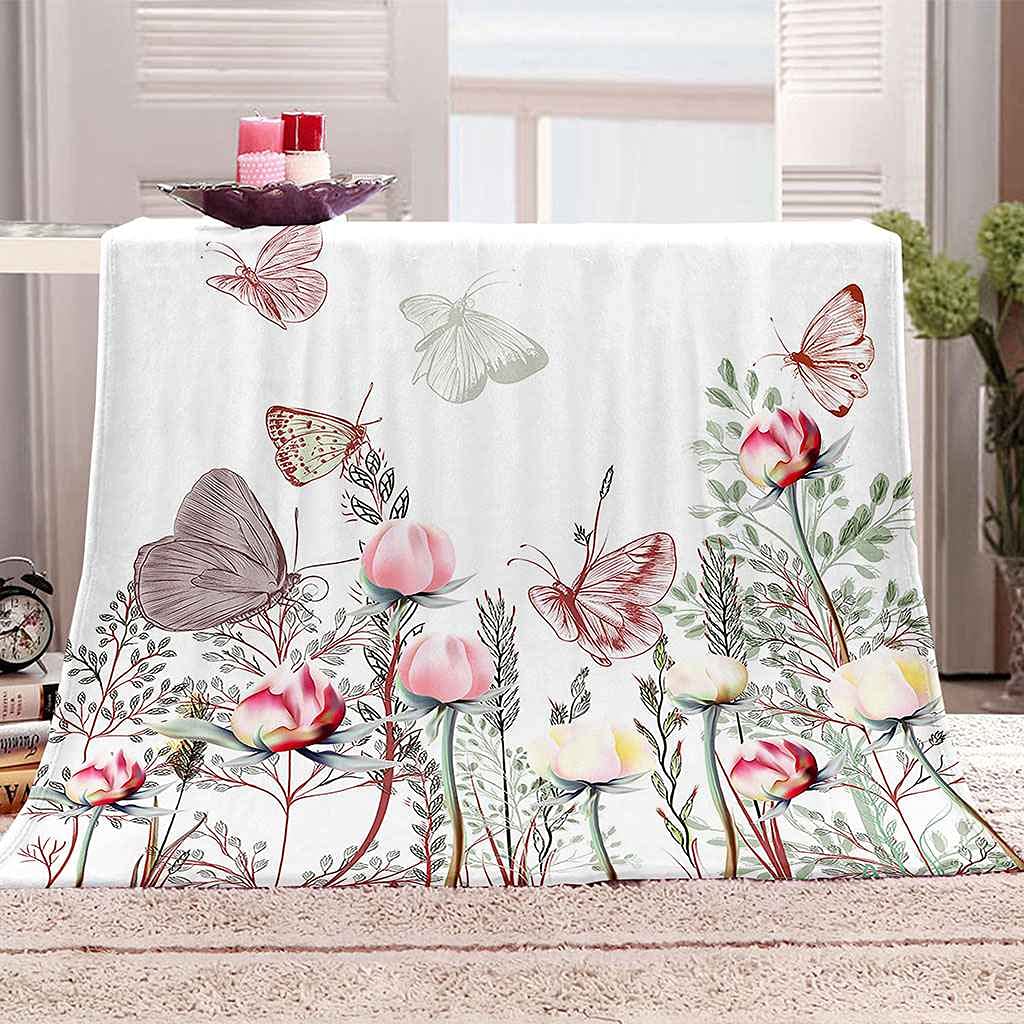 Couverture lit fleur rose pour des soirées cocooning au salon