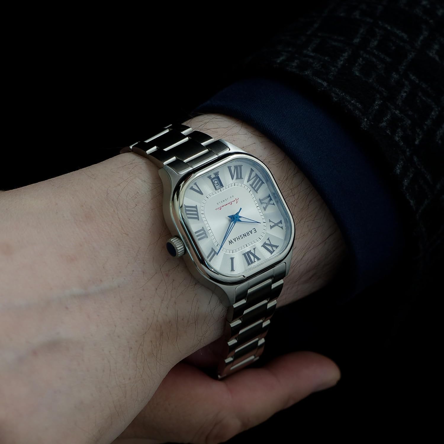 Thomas Earnshaw Coussin Automatic Watch on a book