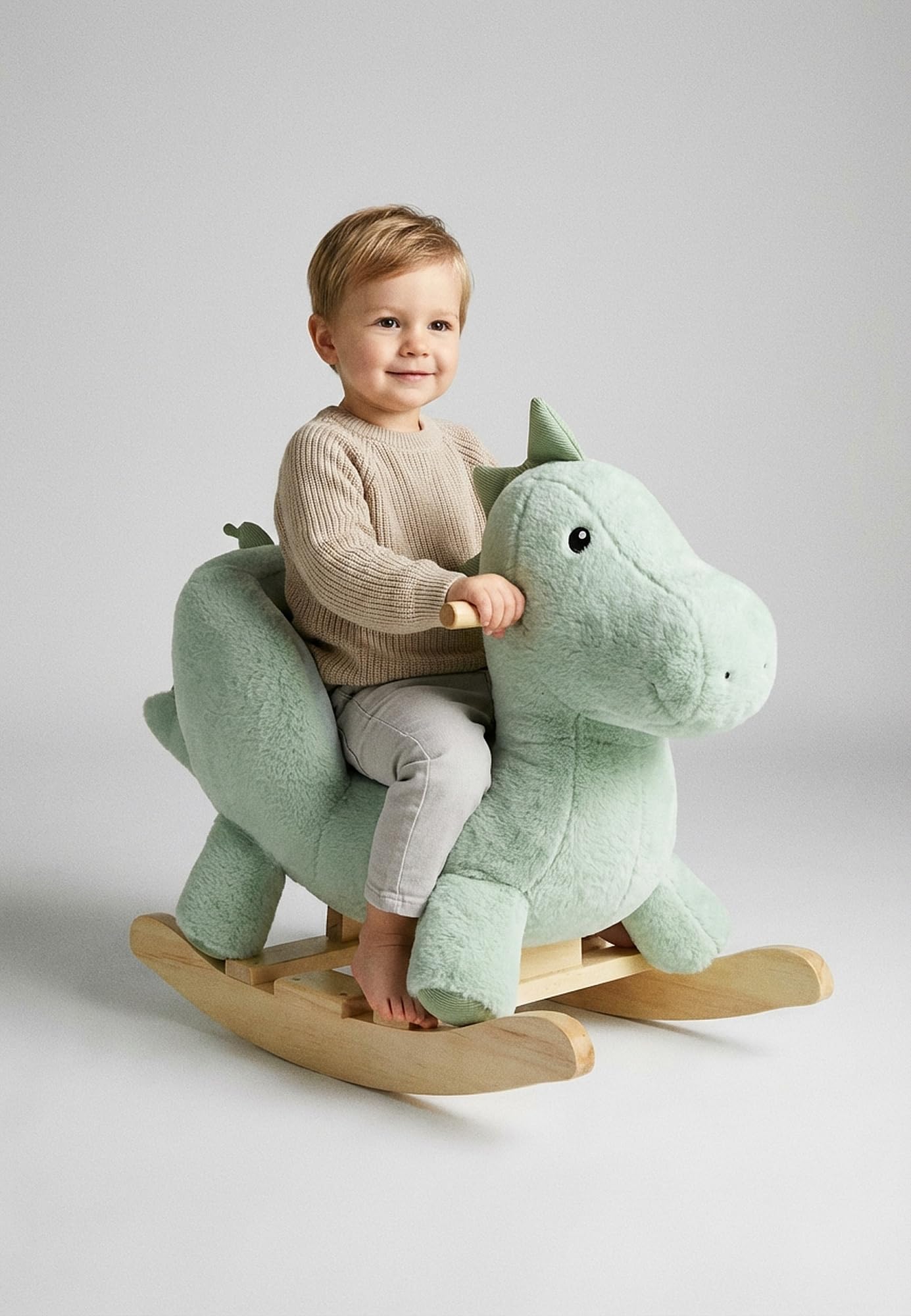 Sterntaler Schaukeltier Dino Rexi - Schaukeltier aus kuscheligem Plüsch und weicher Sitzfläche - Schaukelpferd für Kinder - Spielzeug Wippe für Baby und Kinder, pudergrün