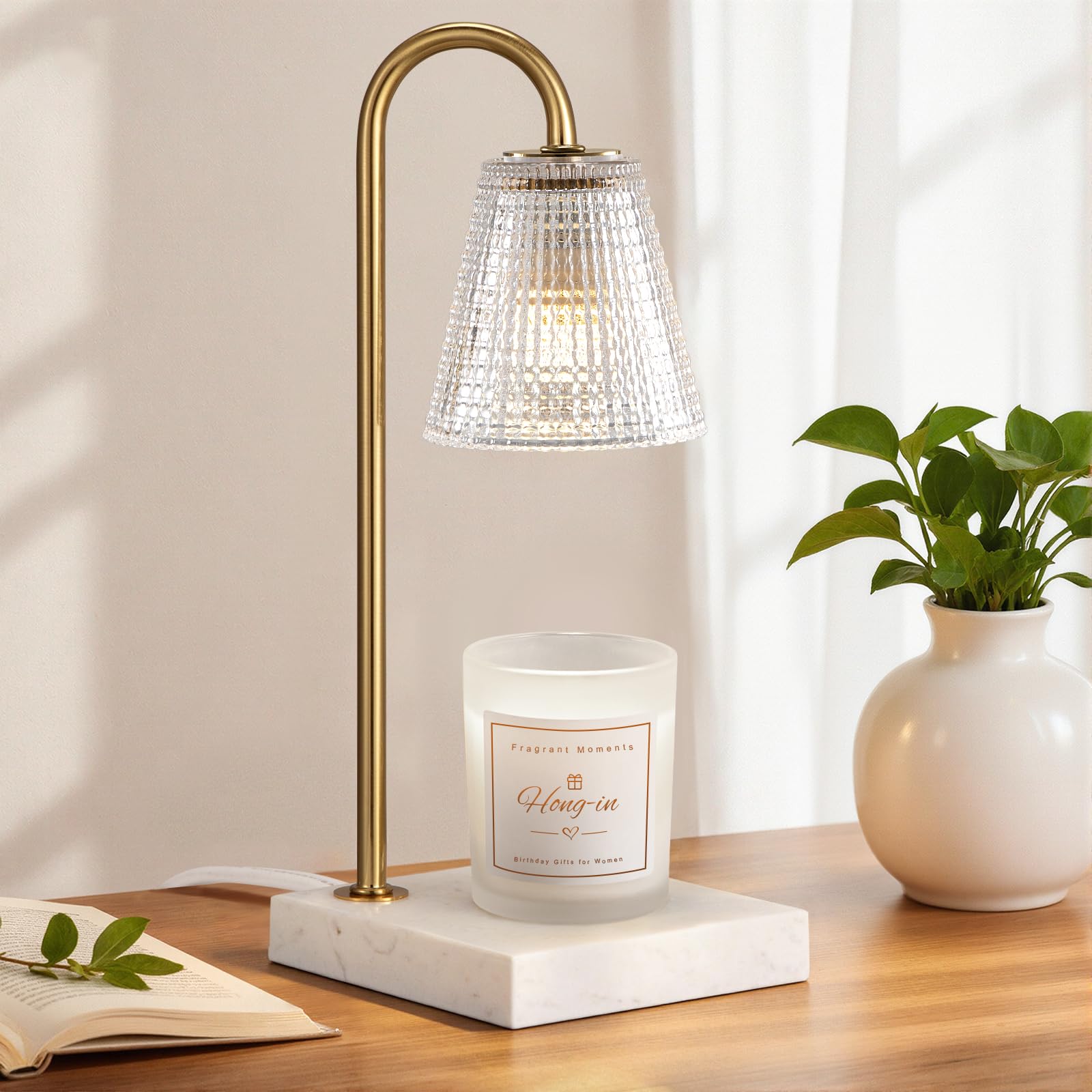 Hong-in candle warmer with gold base, marble detail, and clear polka dot glass shade