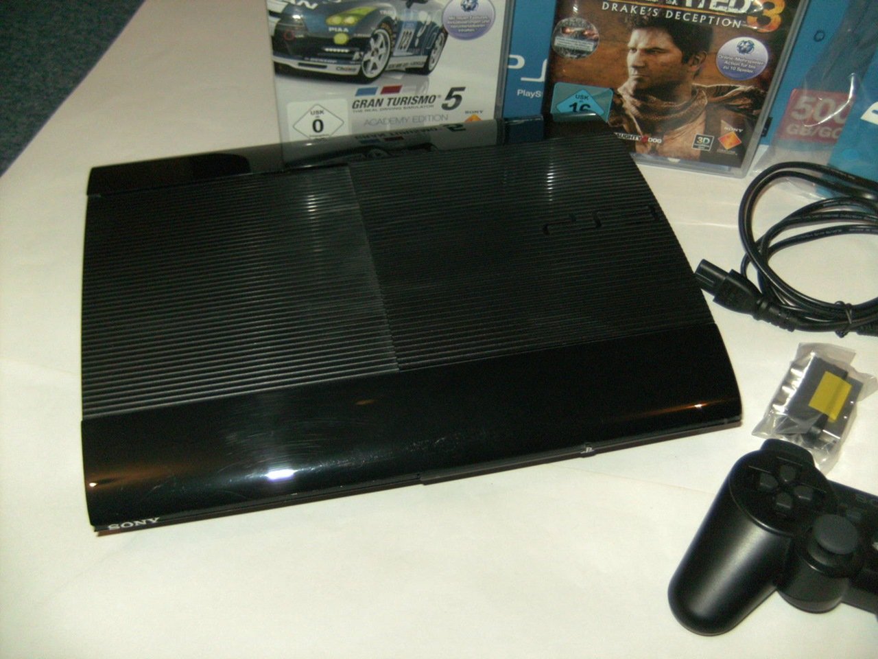 PS3 - Konsole Slim 500 GB SuperSlim + Uncharted: Drakes Deception GOTY & Gran Turismo 5: Academy Edition [Edizione: Germania]