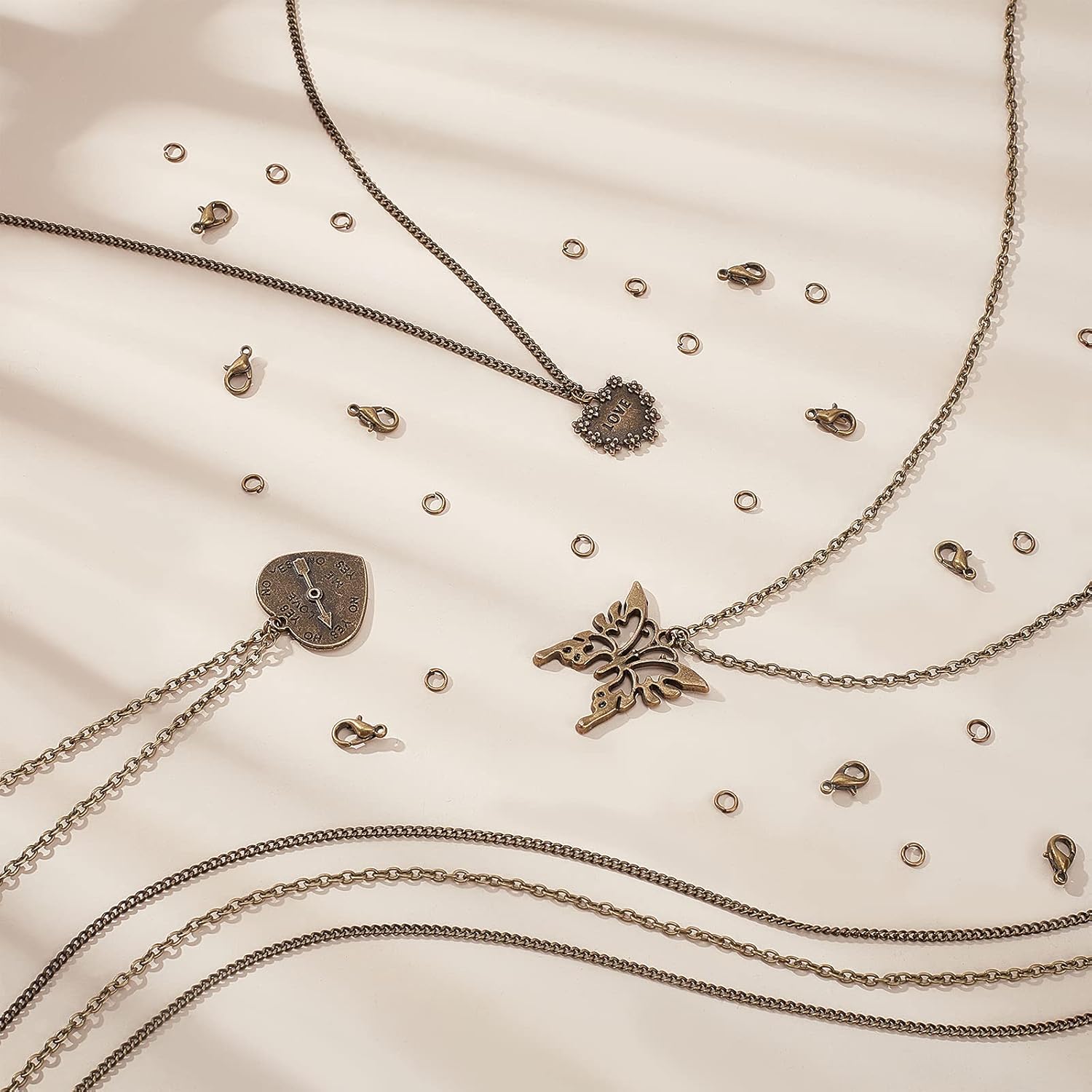 PH PandaHall 32 Feet Necklace Chains, Link Cable Chains Twisted Curb Chain Antique Bronze Cross Chain with 20pcs Lobster Claw Clasps 100pcs Jump Rings for Jewelry Making DIY Crafts - Image 2