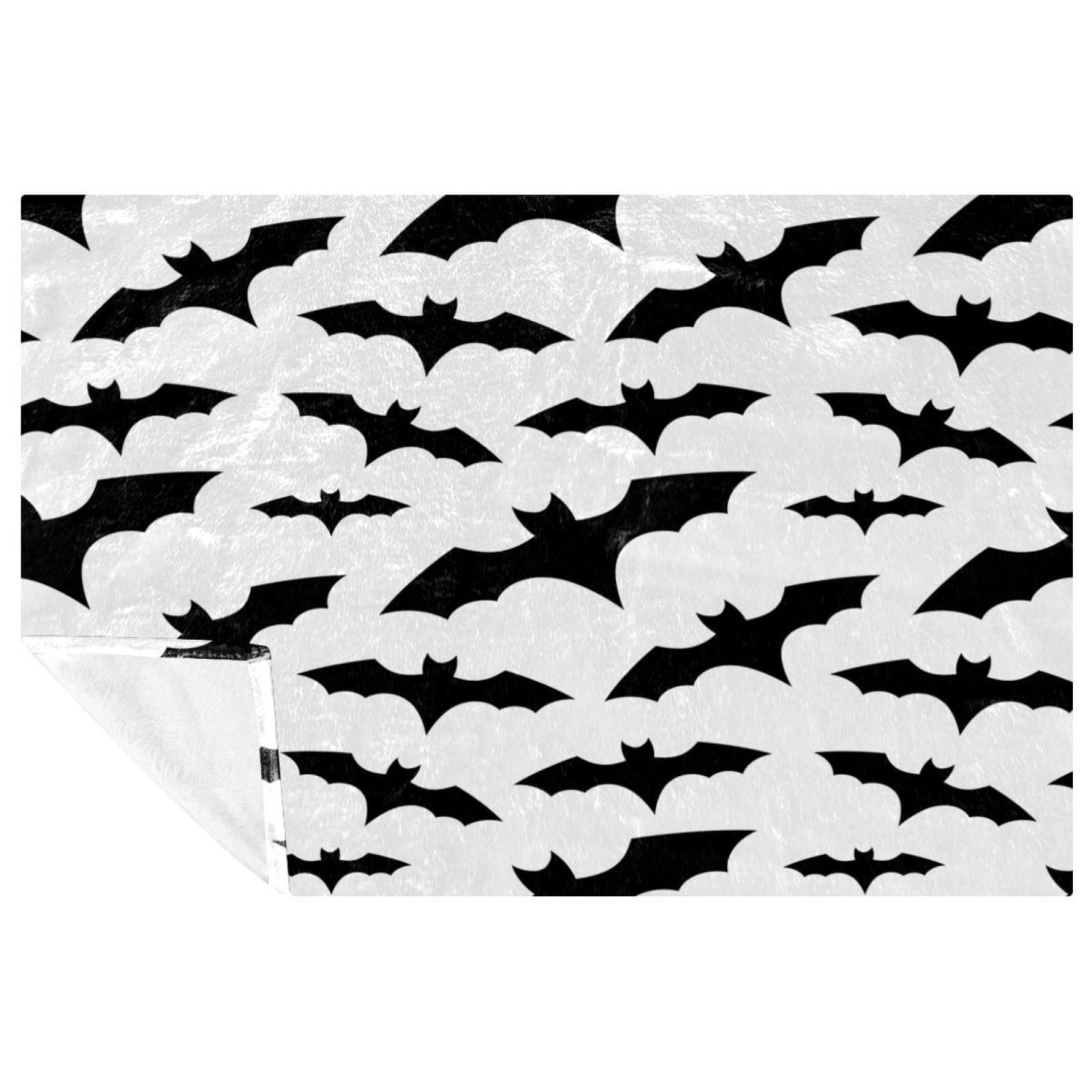 Couverture de chauve-souris d'Halloween noire contre le froid automnal sur votre canapé