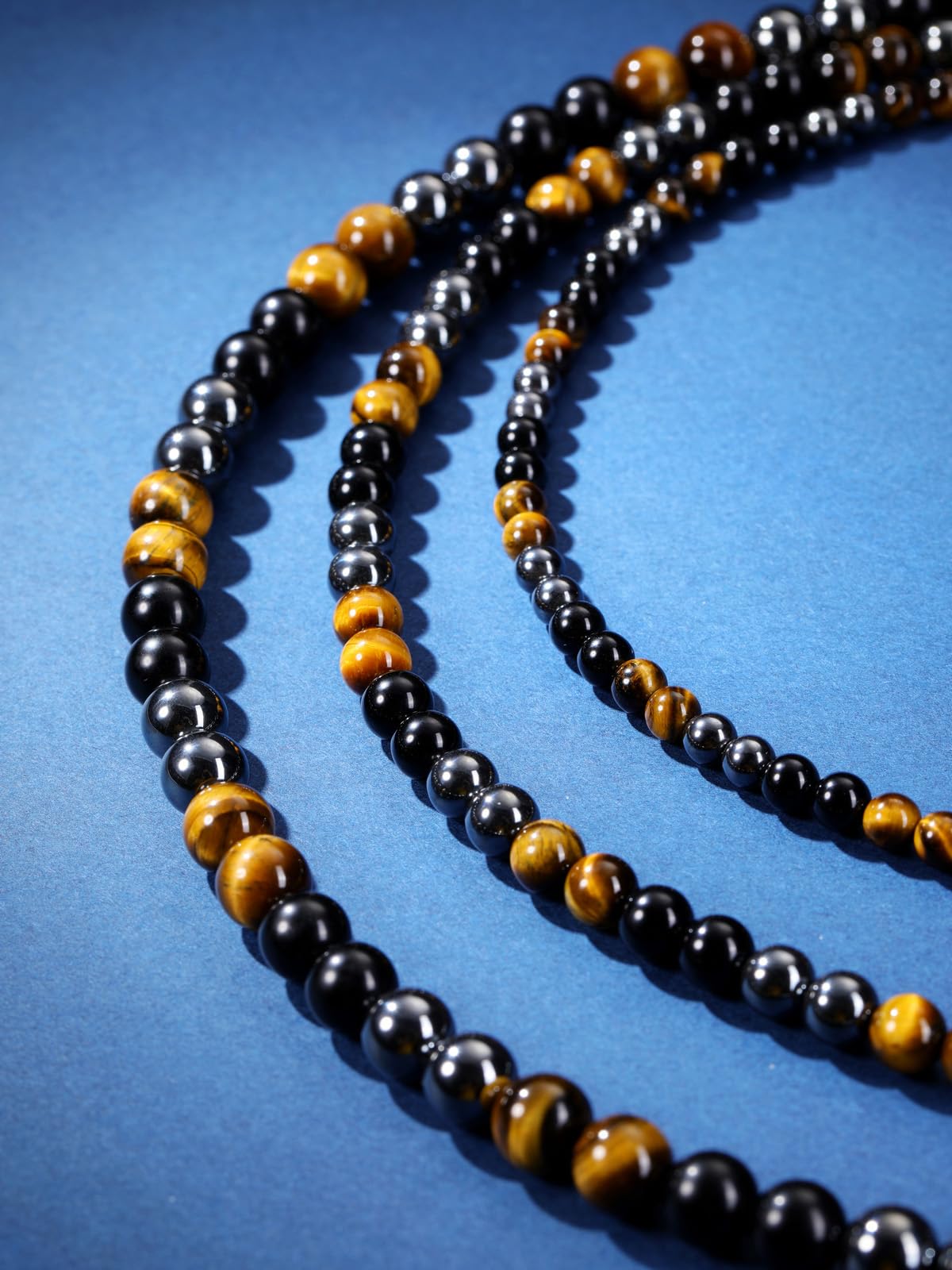 JSDDE Collier Perles en Pierres et Cristaux Naturelles pour Homme Femme Collier Triple Protection en Oeil de Tigre Obsidienne Hématite Pierres Précieuses Bijoux Amulette Cadeau Spirituel Anniversaire