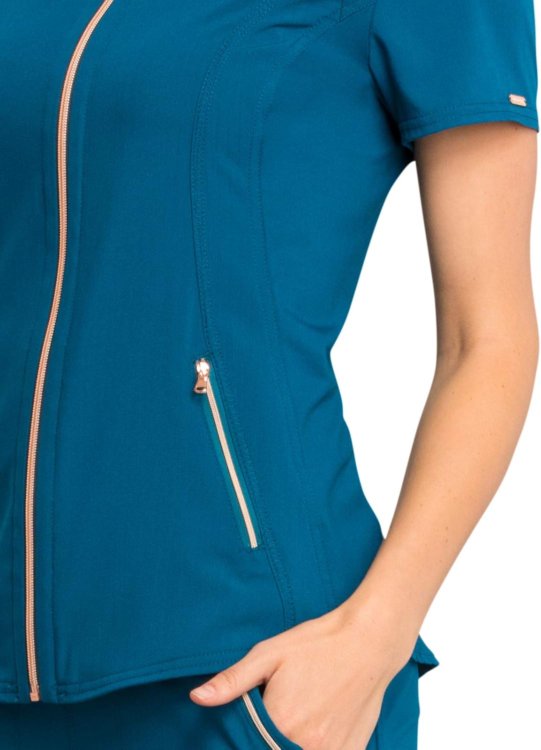 Close-up of the rose gold zipper pocket on the Cherokee Statement CK795 top