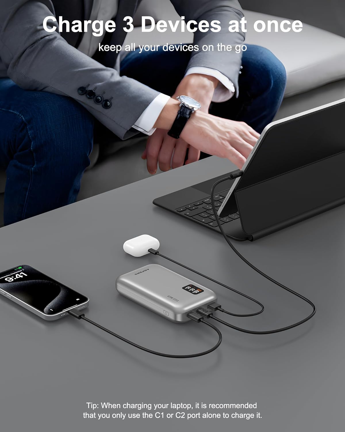 AsperX 65w power bank charging a laptop and phone at once