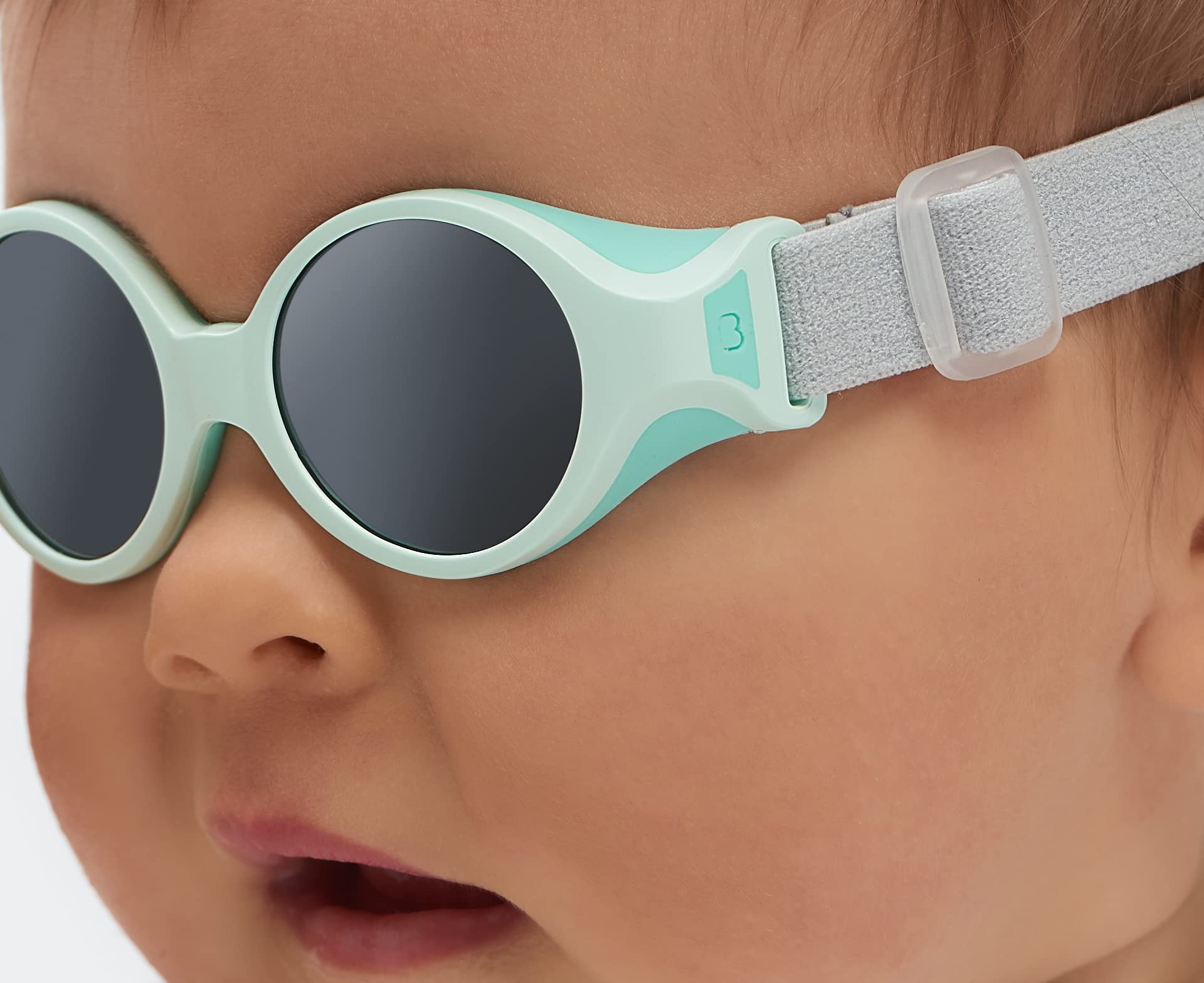 Béaba, Lunettes de soleil pour bébé 0-9 mois, Protection 100% UV - CAT 4, Protection Latérale, Confort Optimal, Bandeau élastique ajustable, Vert d'eau