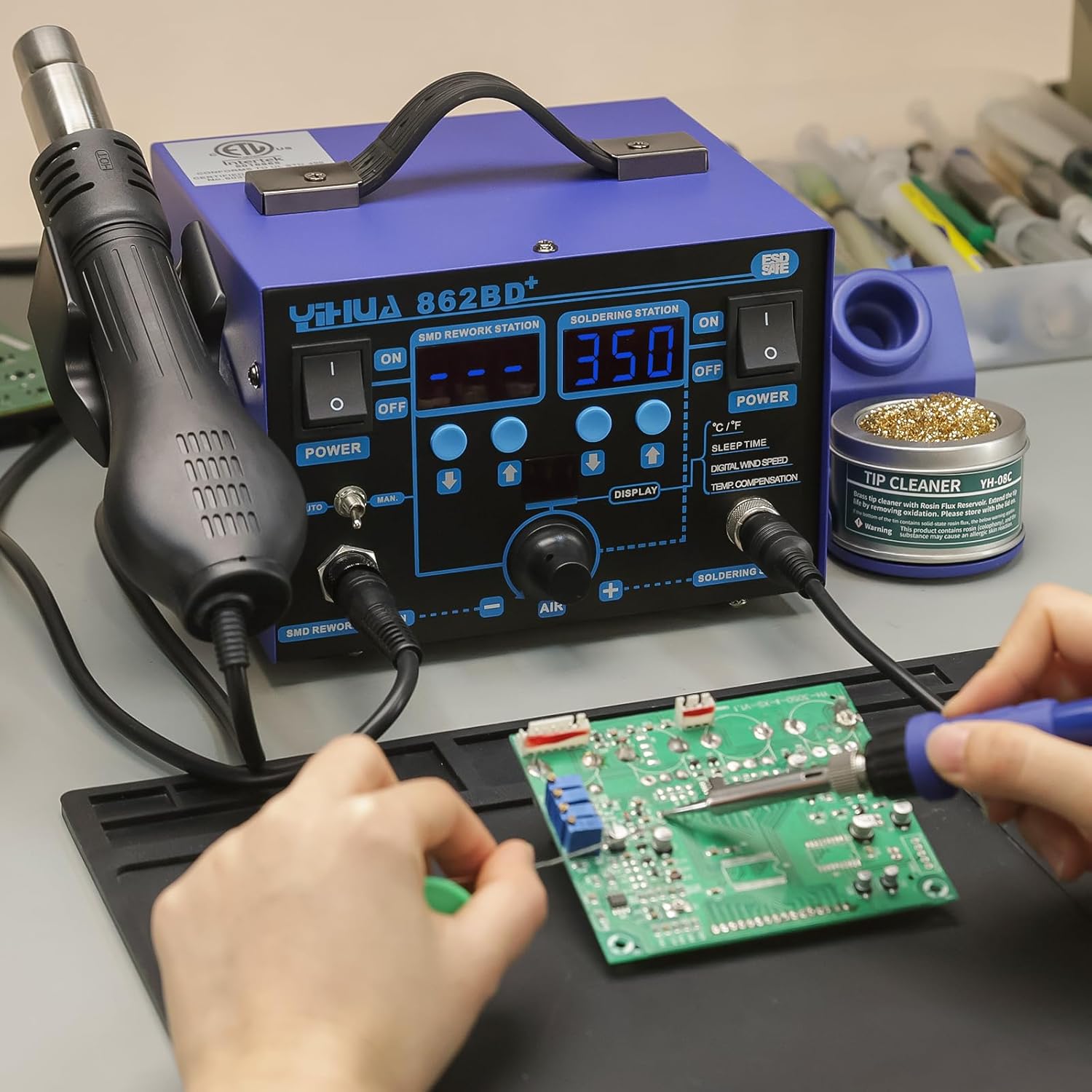 A user performing soldering work on a circuit board using the YIHUA 862BD+ station.