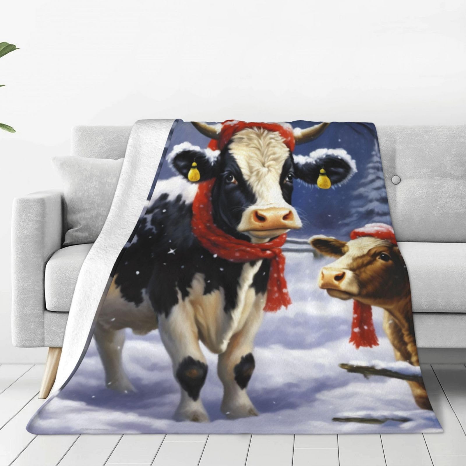 Couverture de Noël motif vache pour un hiver cocooning au salon
