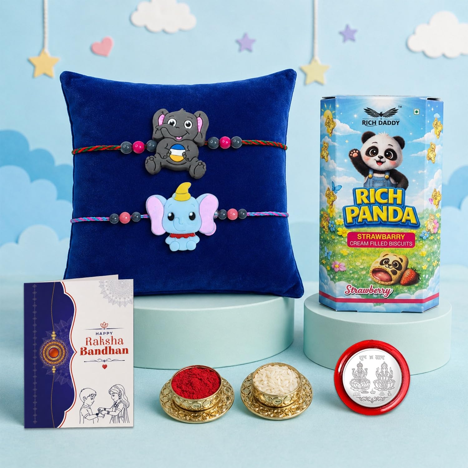 DeoDap Kids Rakhi Gift Set β 2 Cute Elephant Designer Rakhis with Rich Panda Strawberry Biscuits 60g, Silver Color Coin, Tilak Set & Greeting Card | Raksha Bandhan Gift for Boys 1