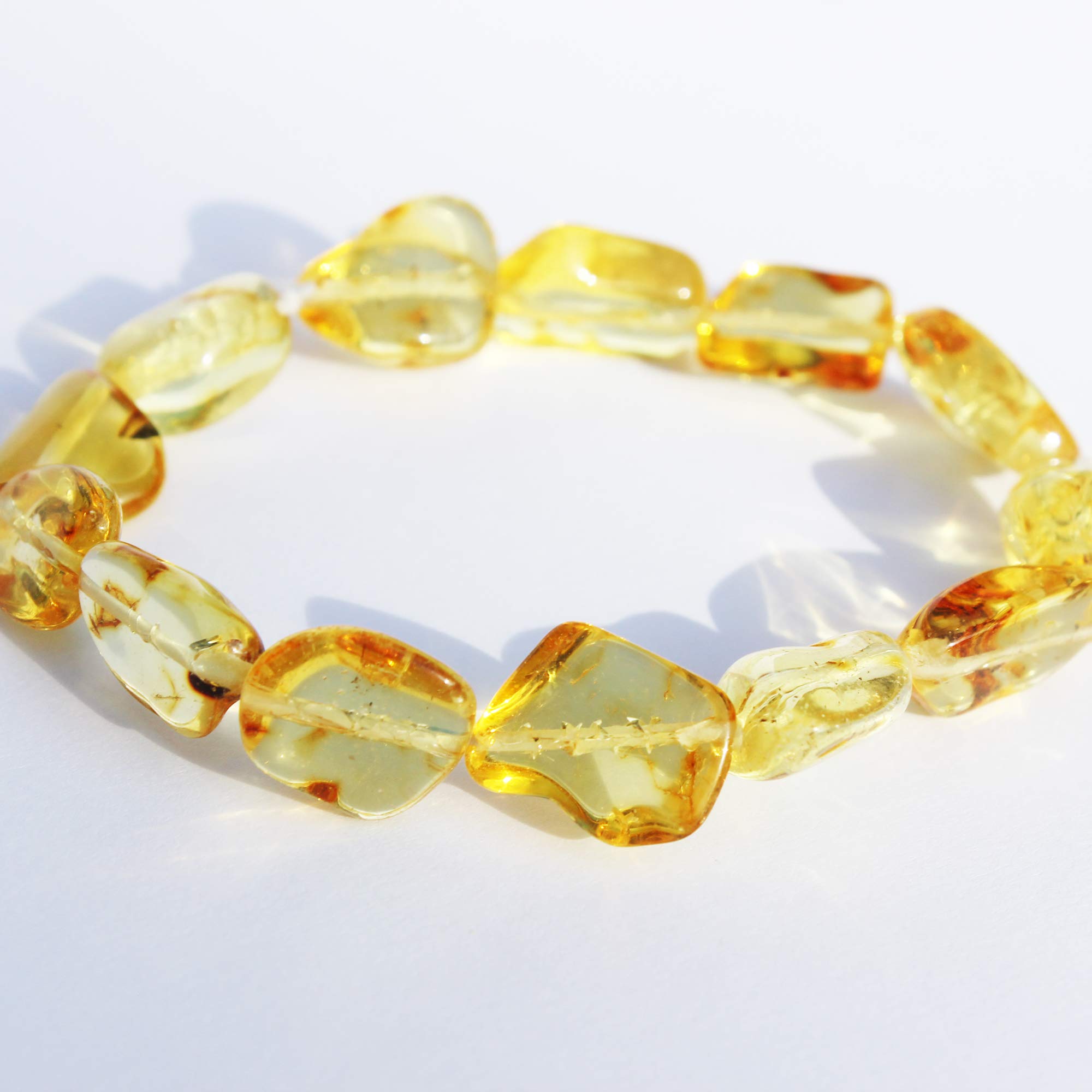 Baltic polished lemon amber bracelet made from amber chunks. (approx. 13 beads). fits all wrists. beaded bracelet