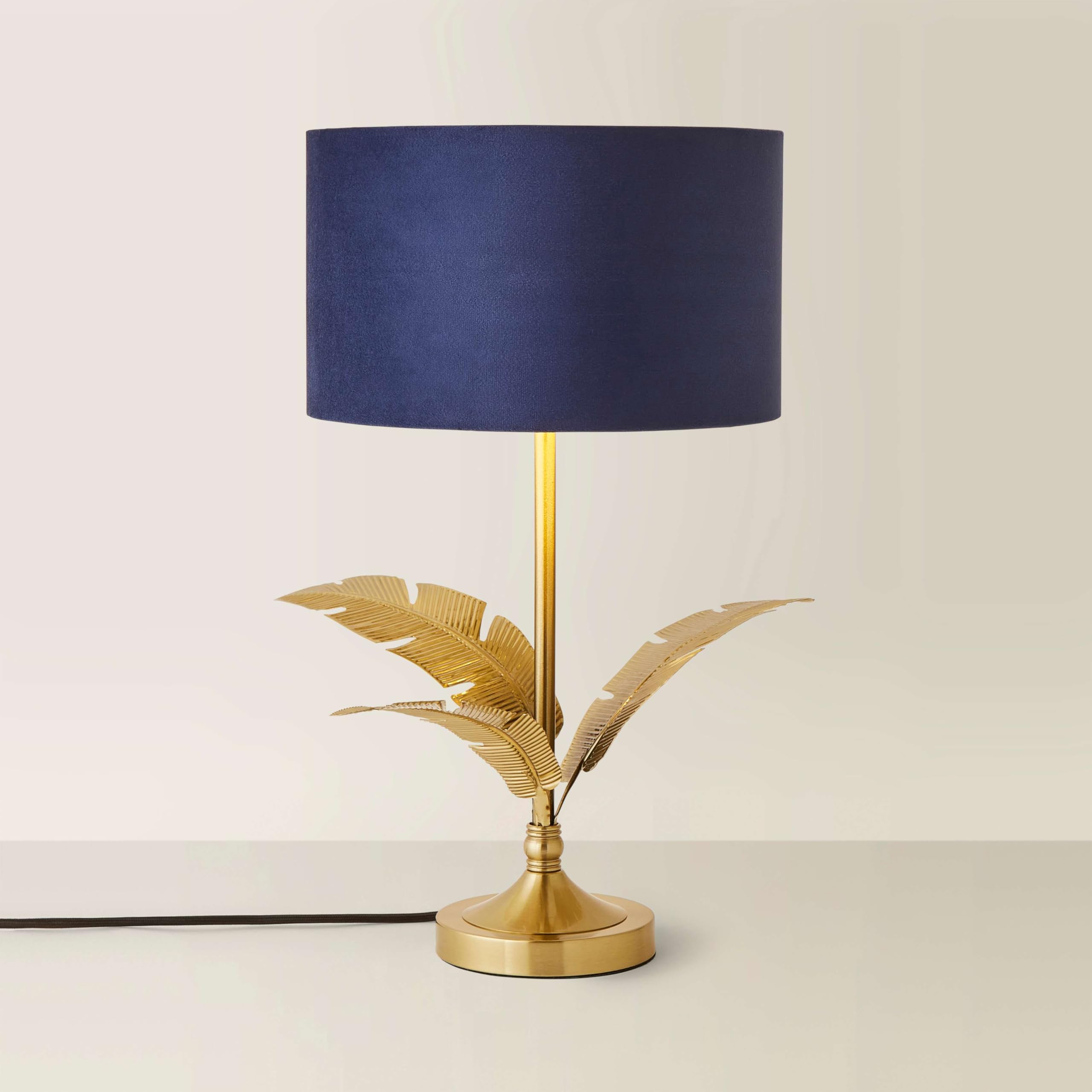 Valuelights Christina Navy Blue Velvet With Gold Inner Drum Shade Gold Palm Leaf Table Lamp from B&Q