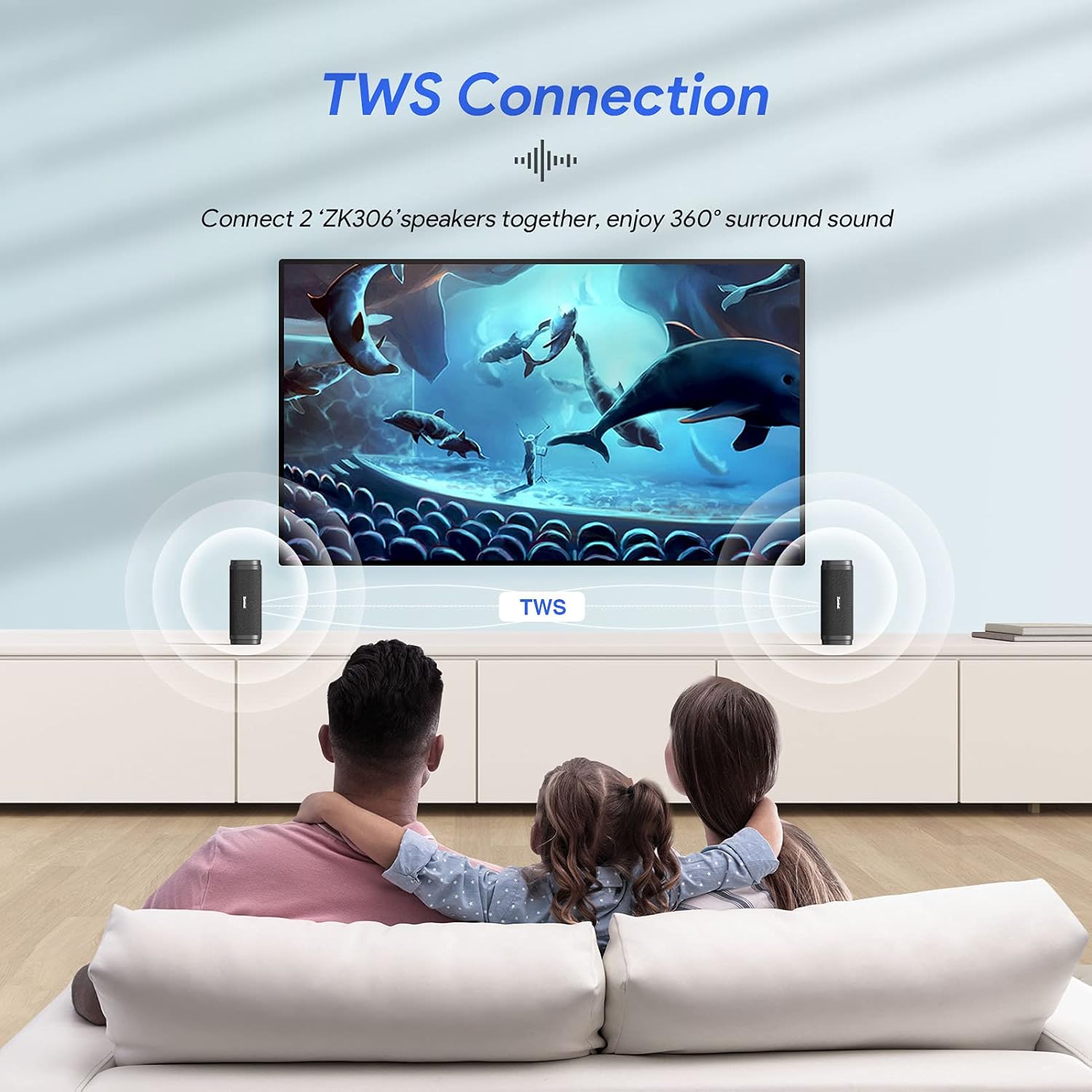 Two ZAMKOL speakers wirelessly connected for TWS stereo sound, placed near a TV