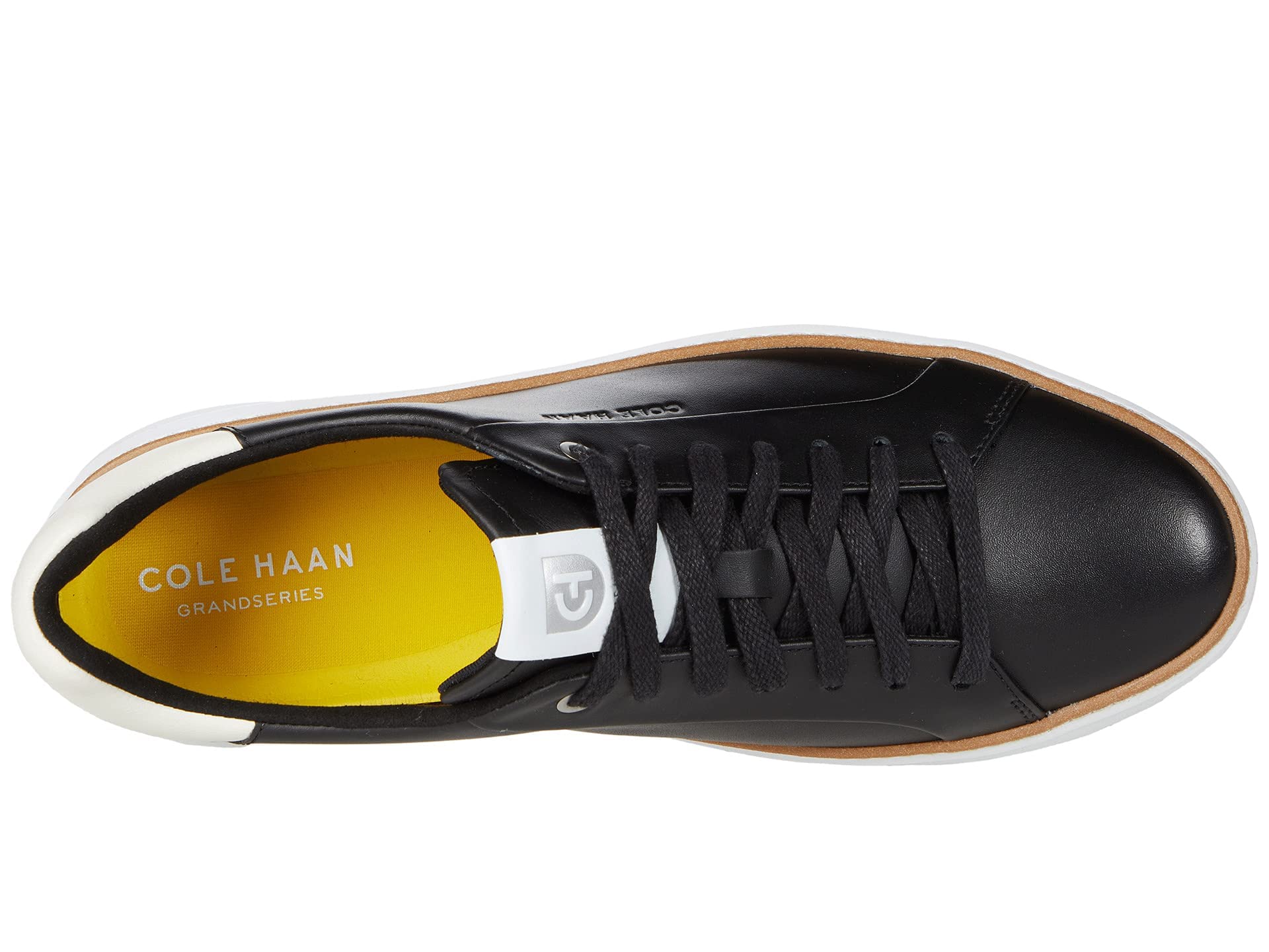 Close-up view of the Cole Haan Women's Grandpro Topspin Court sneaker's design and material.