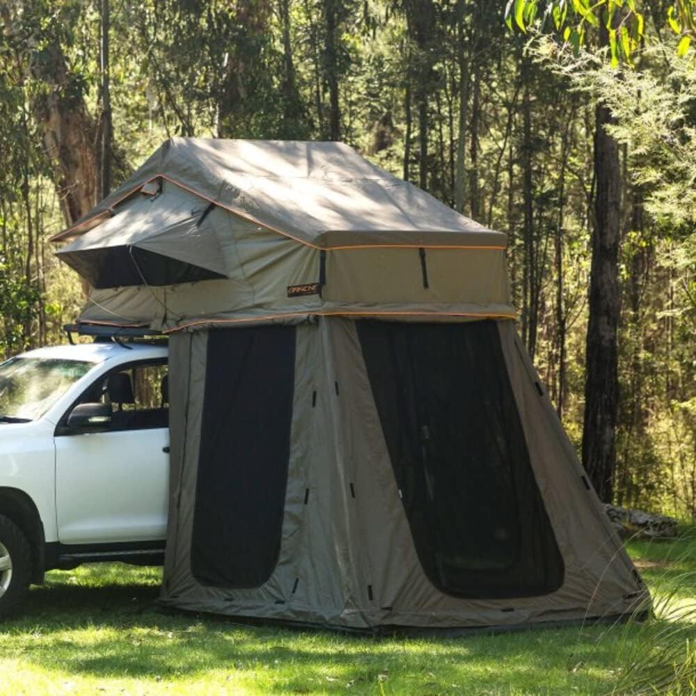 The Darche HI-VIEW1600 Annex fully set up next to a white SUV with a rooftop tent, showing the side profile.