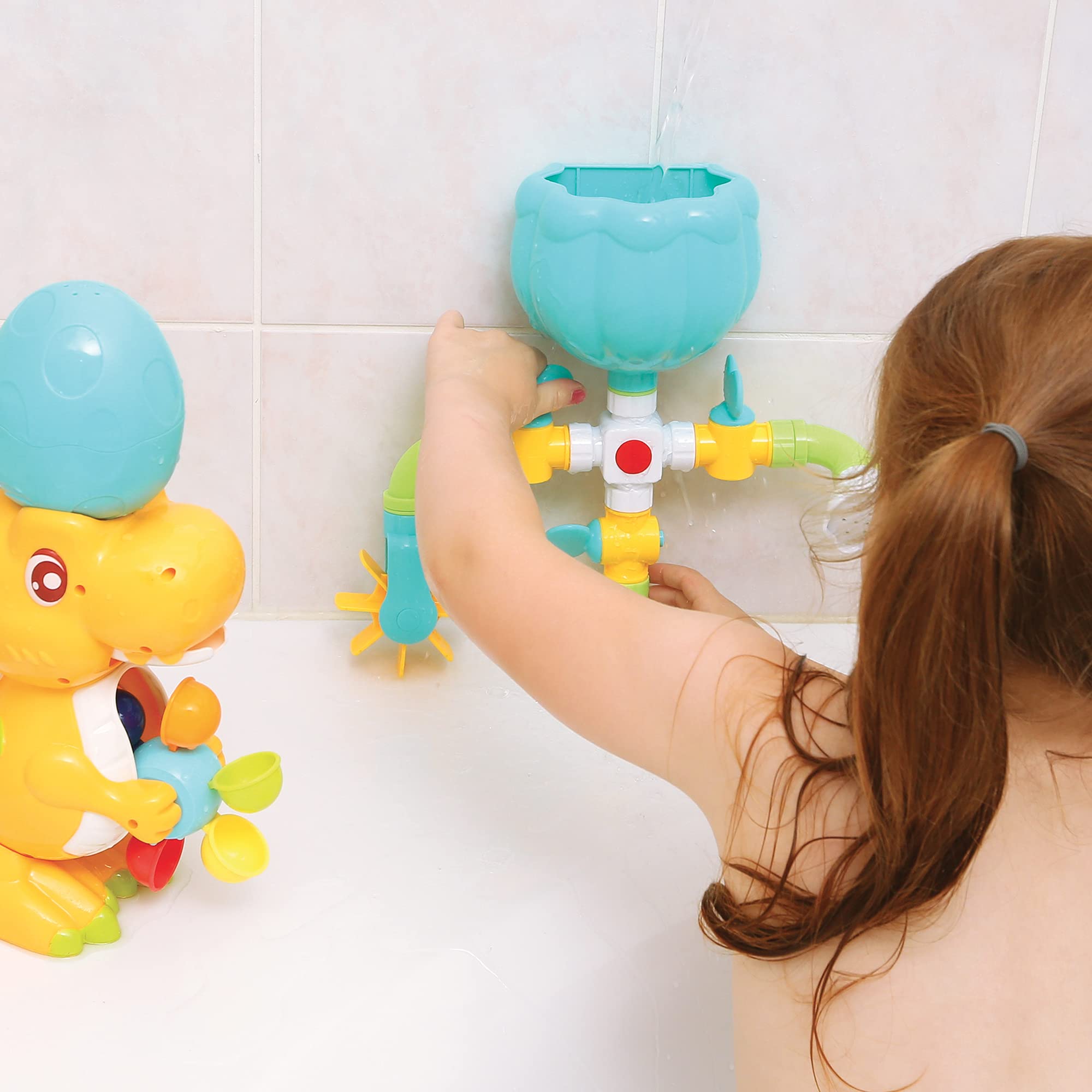 LUDI - Coffret de Bain Dino - 1 Circuit d’Eau à Construire, 1 Grand Dinosaure, 1 Bébé Dino Aspergeur - Jouet de Bain pour Bébé à Ventouser - Modulable, Evolutif et Éducatif - À Partir de 18 Mois