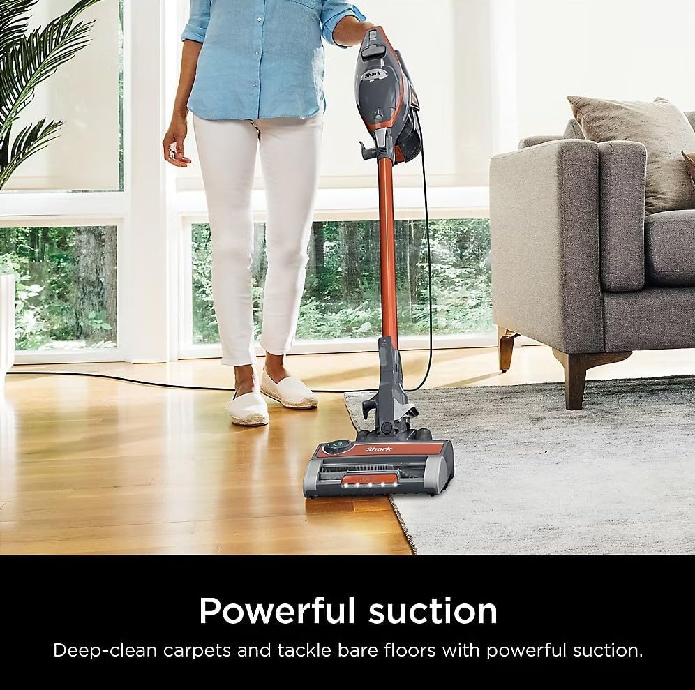 Person vacuuming carpet with Shark Rocket Pro