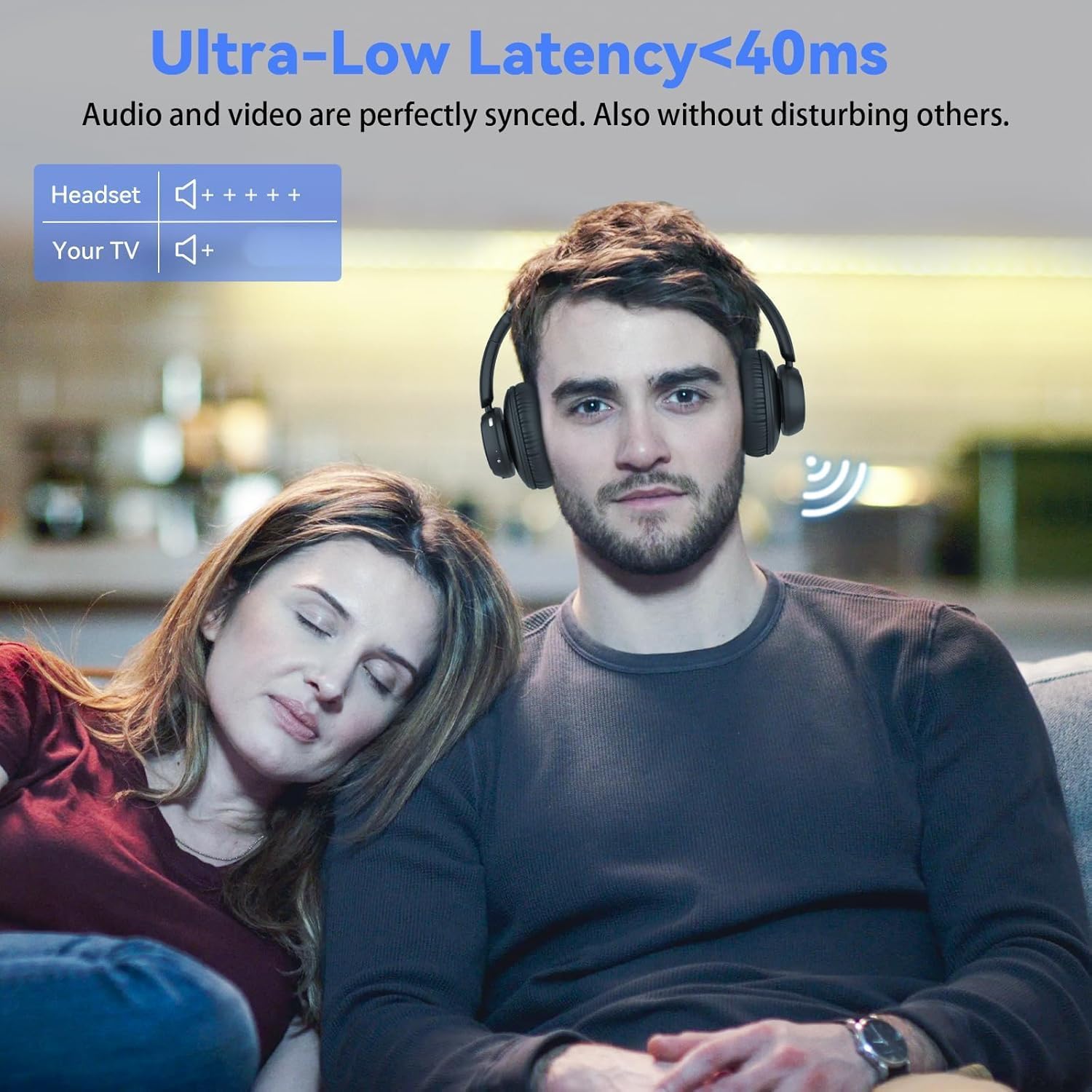 A couple watching TV with one person wearing ANSTEN headphones, illustrating a private listening experience with ultra-low latency.