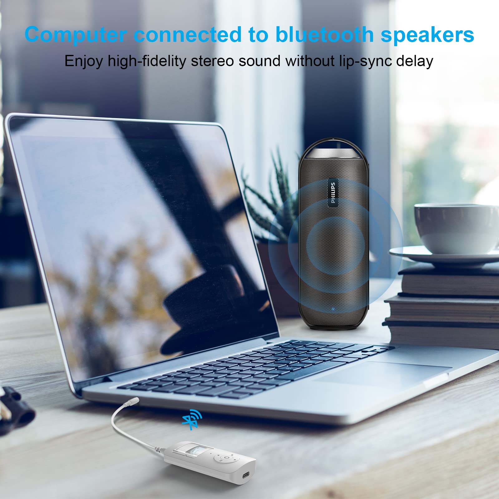 Laptop connected to Bluetooth speaker via adapter