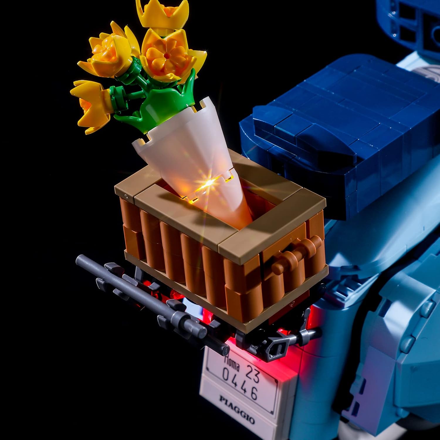 Close-up of the illuminated flower basket on the LEGO Vespa