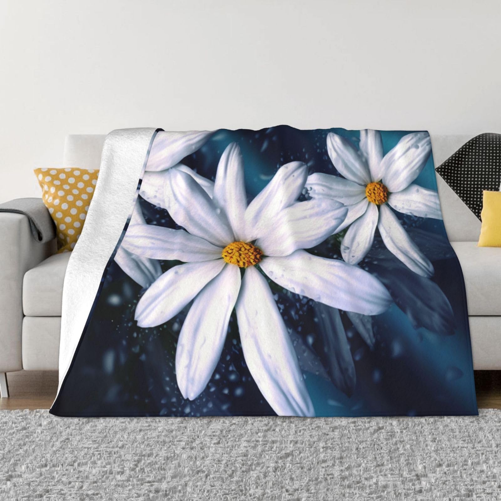 Couverture polaire marguerites pour réchauffer vos soirées cocooning