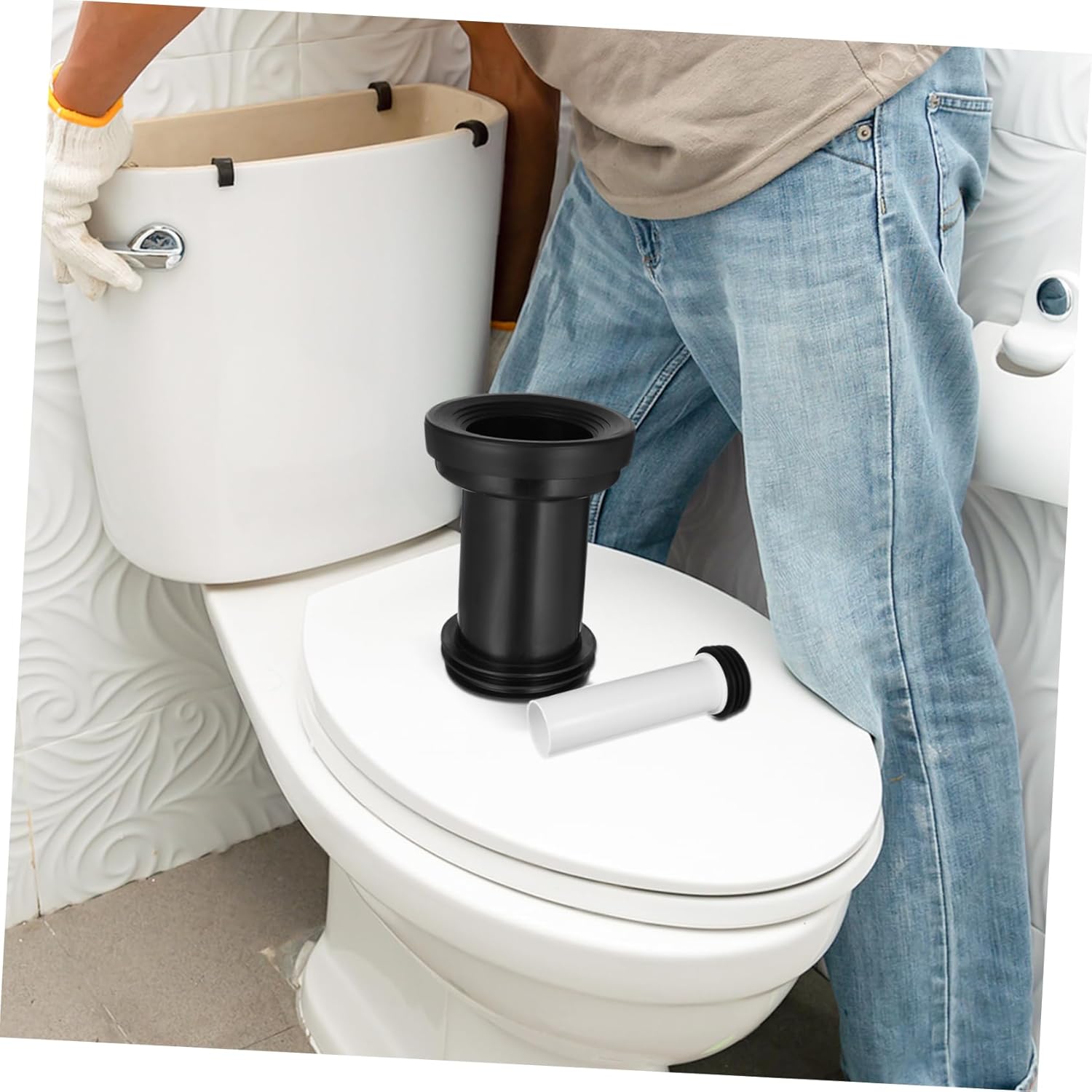 Person installing toilet drain tube