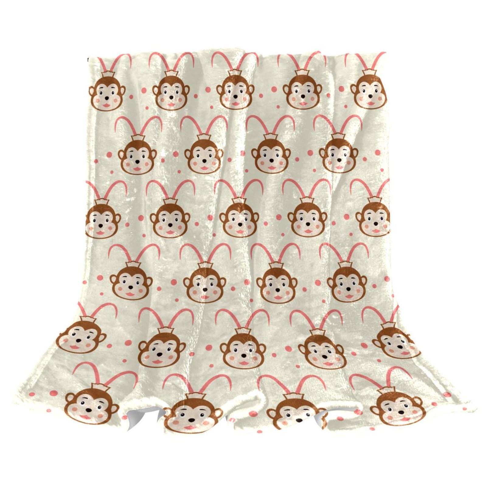 Couverture polaire singe pour soirée cocooning sur le canapé du salon