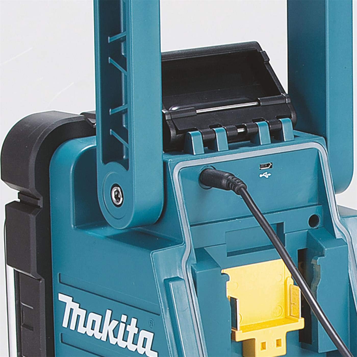Close-up of the Makita DMR110 radio's USB port