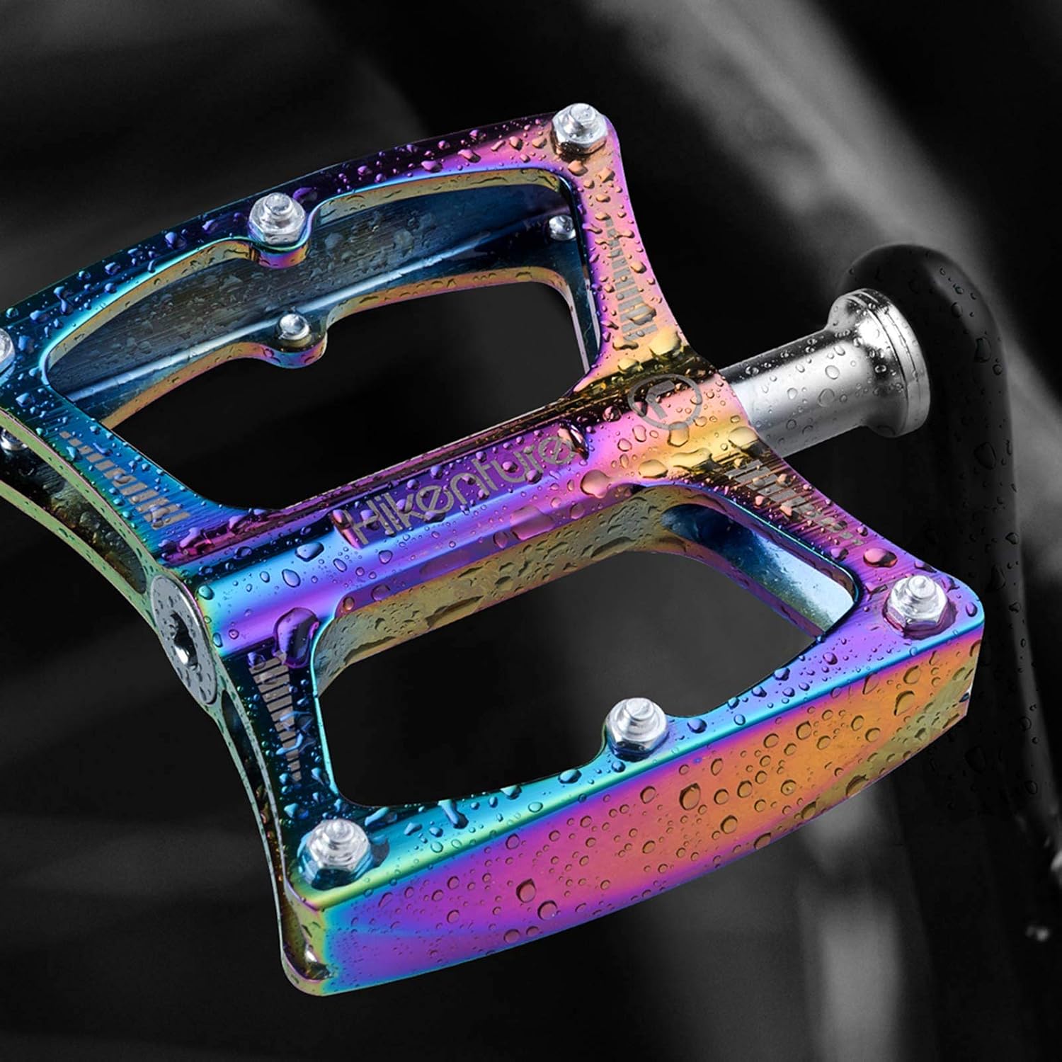 Close-up of HIKENTURE bicycle pedal with water droplets, illustrating its durability in wet conditions