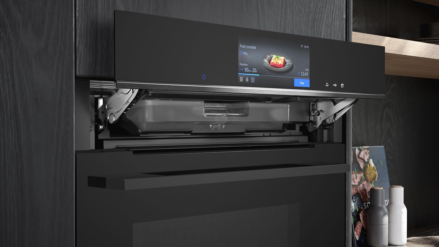 Oven with water tank for steam function pulled out