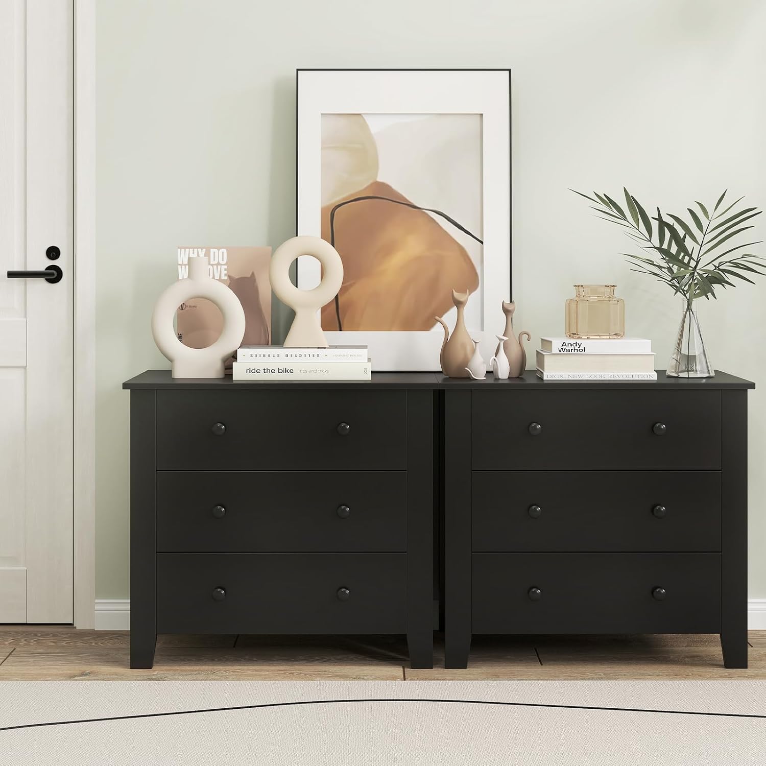 Dresser used as a nightstand next to a bed