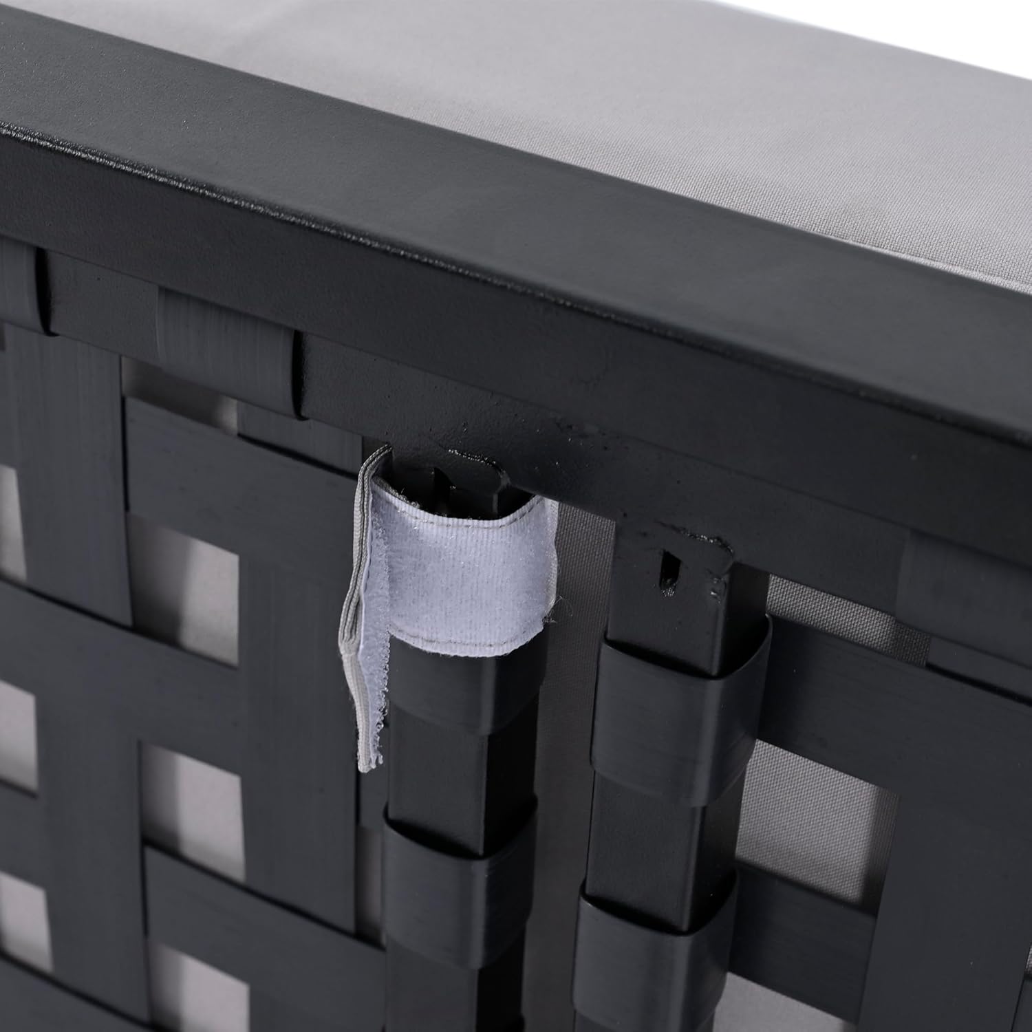 Close-up of velcro straps used to secure cushions to the daybed frame