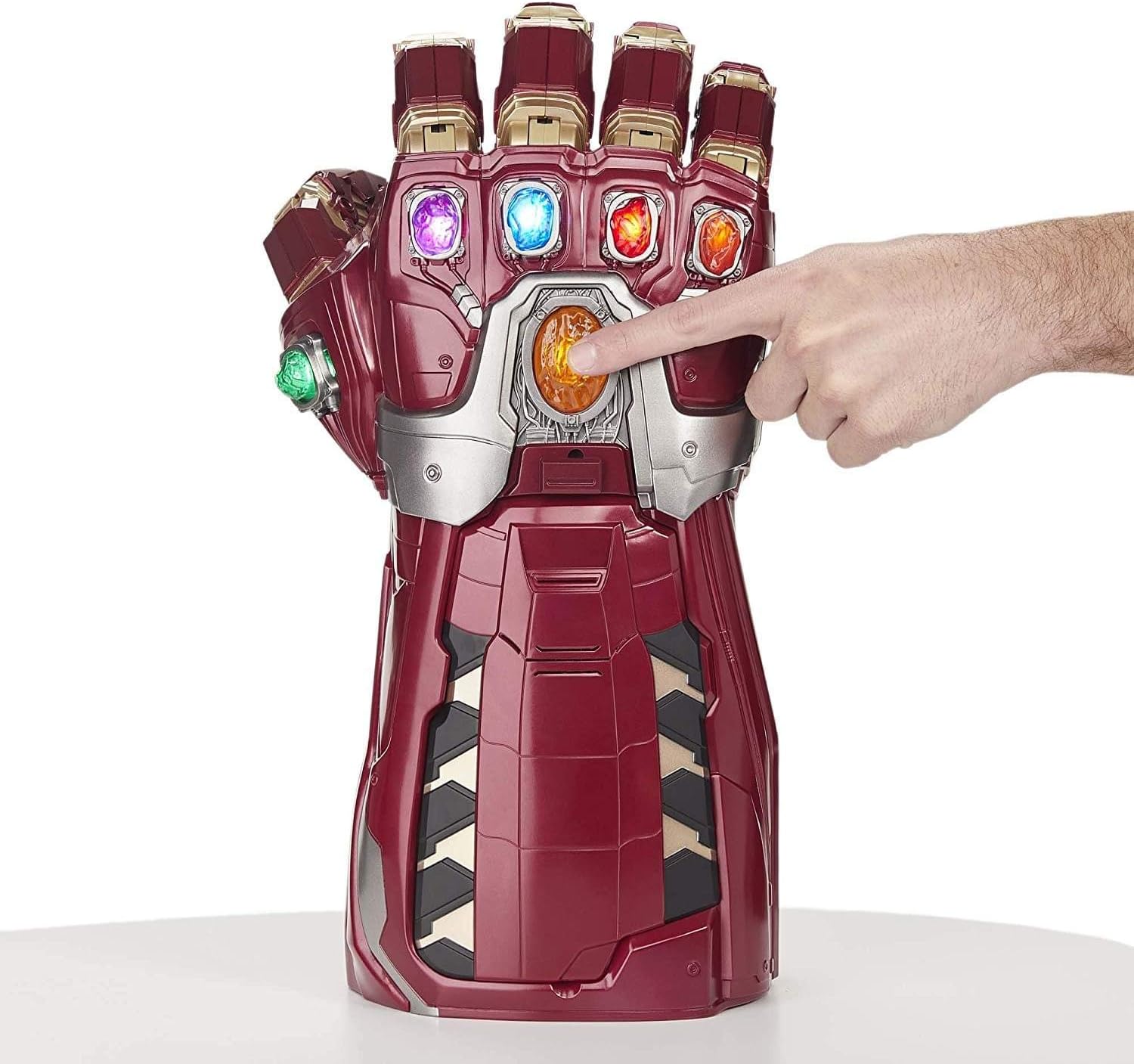 A hand pressing the central yellow Infinity Stone on the Marvel Legends Series Endgame Power Gauntlet to activate its features.
